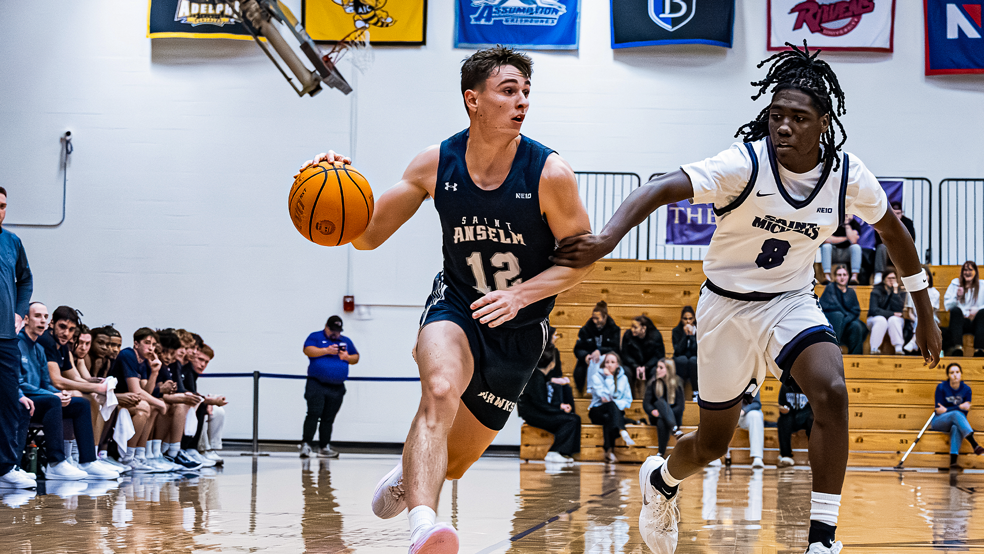 Will Davies driving to the basket at Saint Michael's