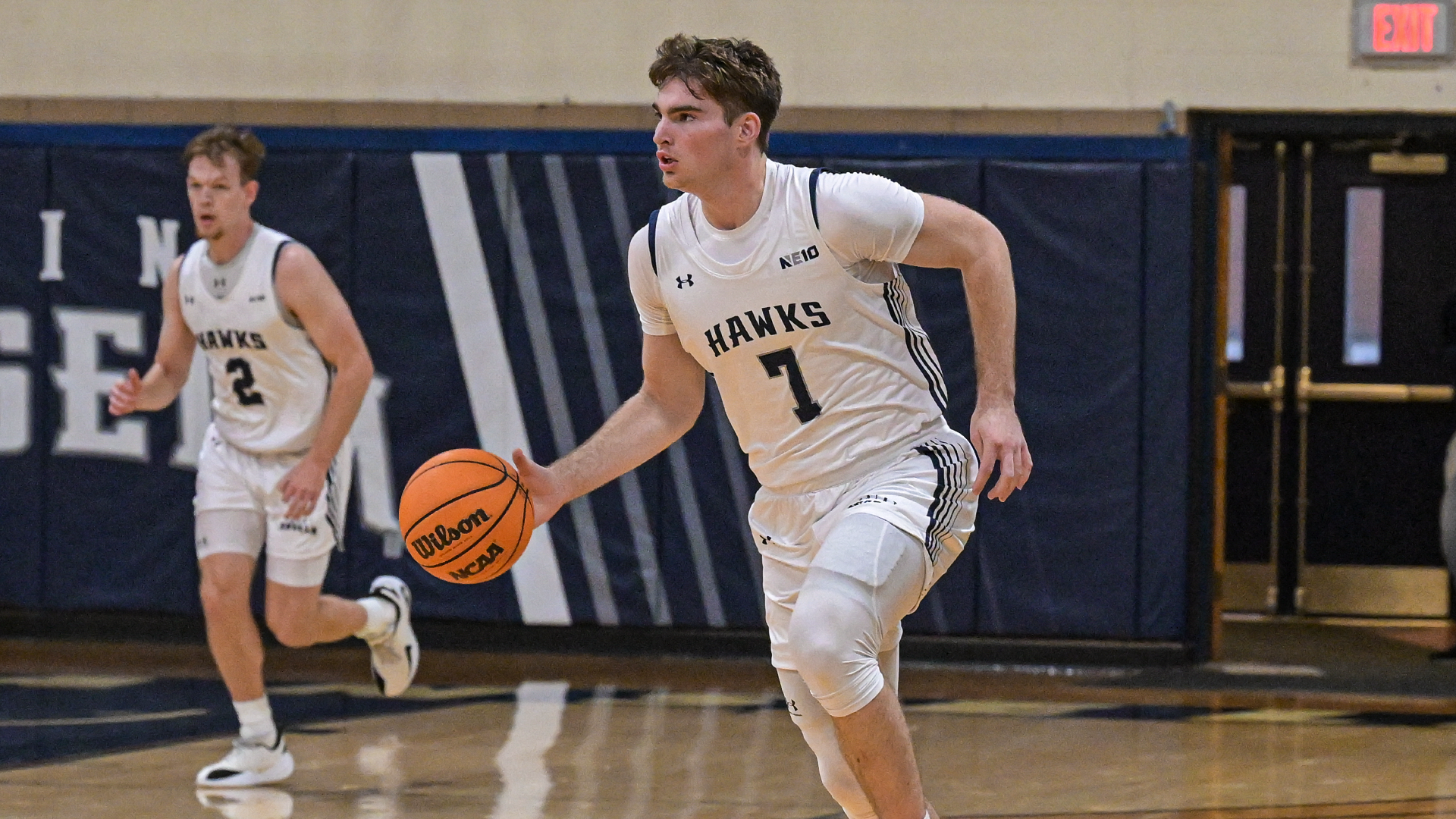 Medalie dribbles the ball up the court versus Post