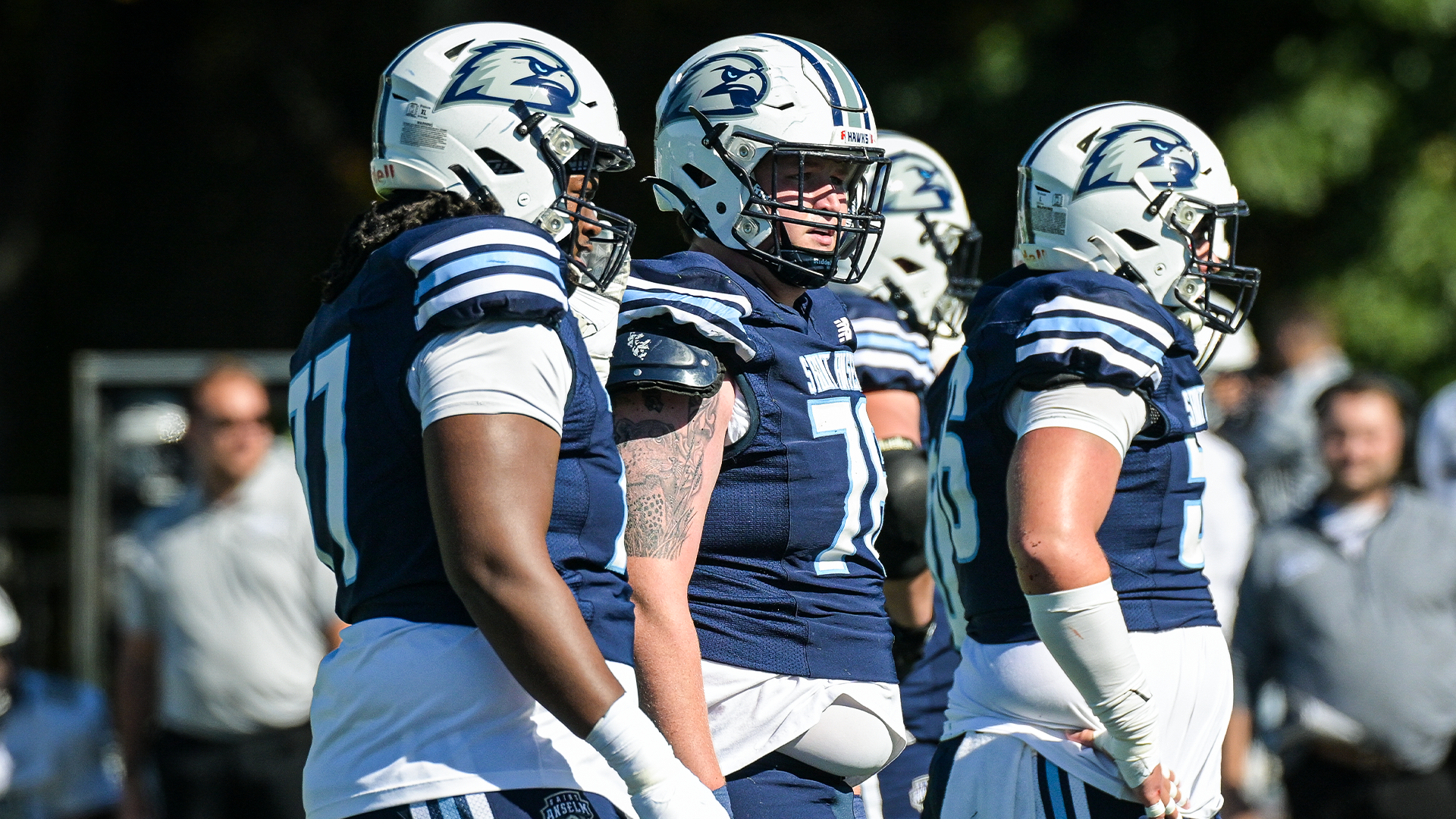 Football linemen await next play