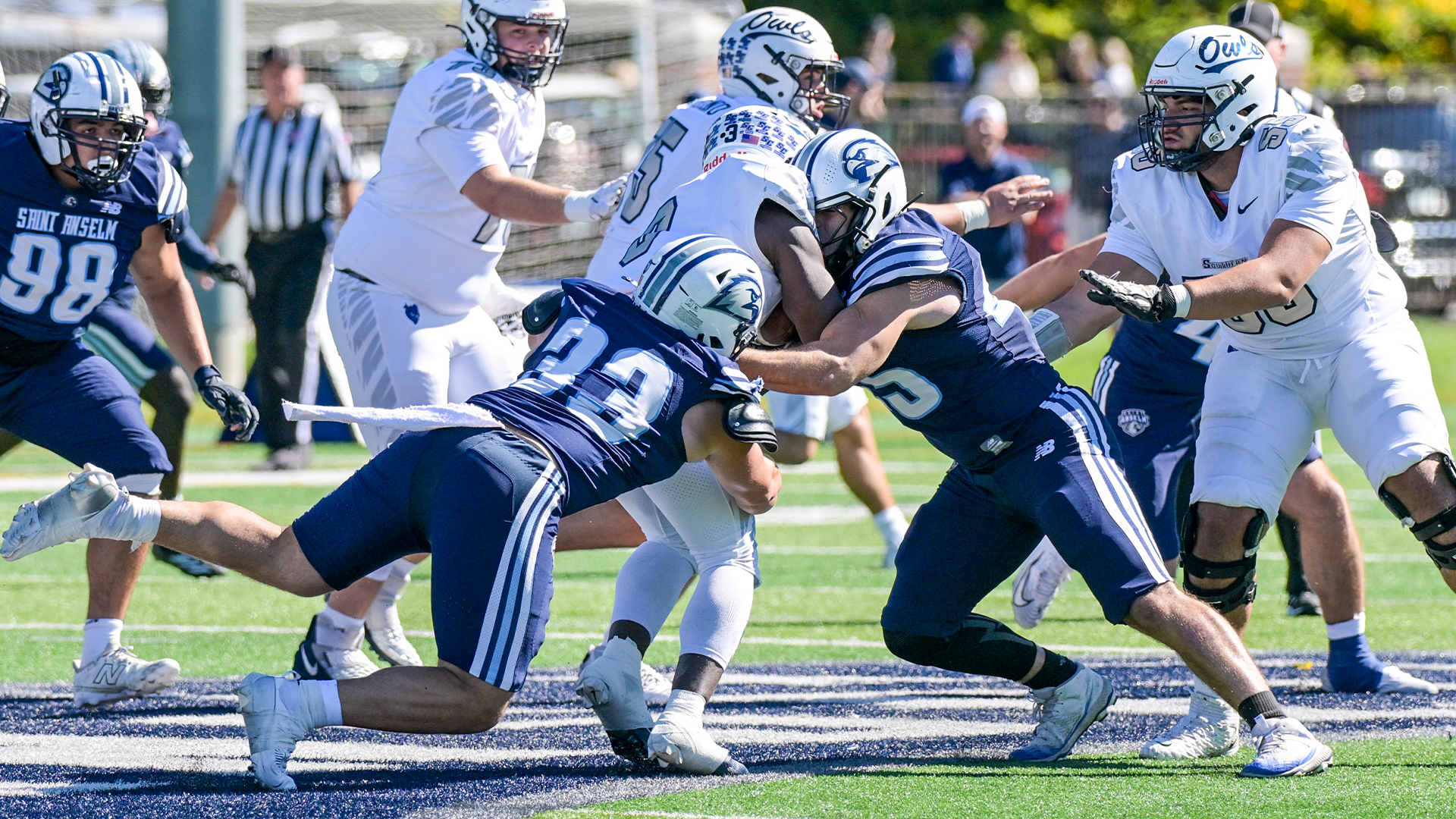 Dangelo Innamorato and Jason Paganis combine for a tackle in Oct. 3 football game versus Southern Connecticut State