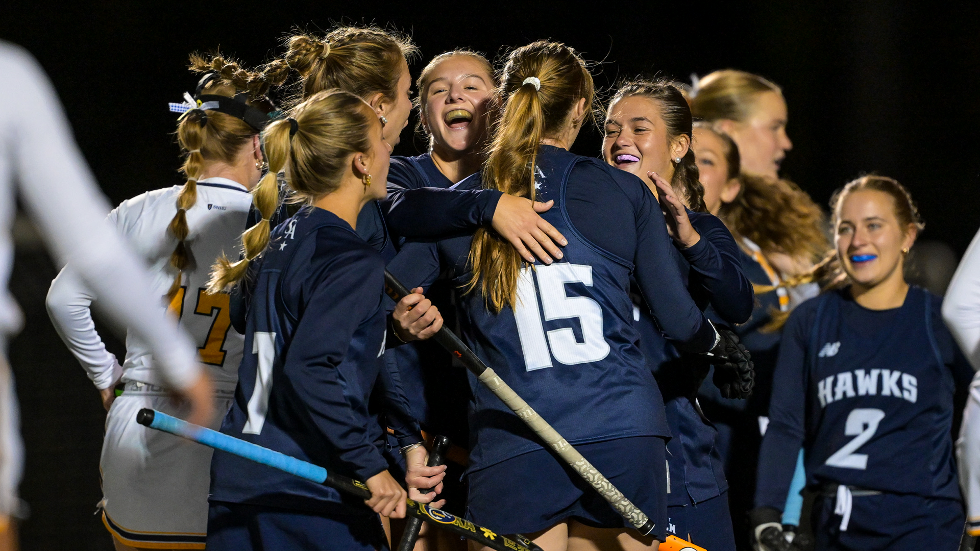 Field hockey players celebrate goal during 5-1 win over SNHU