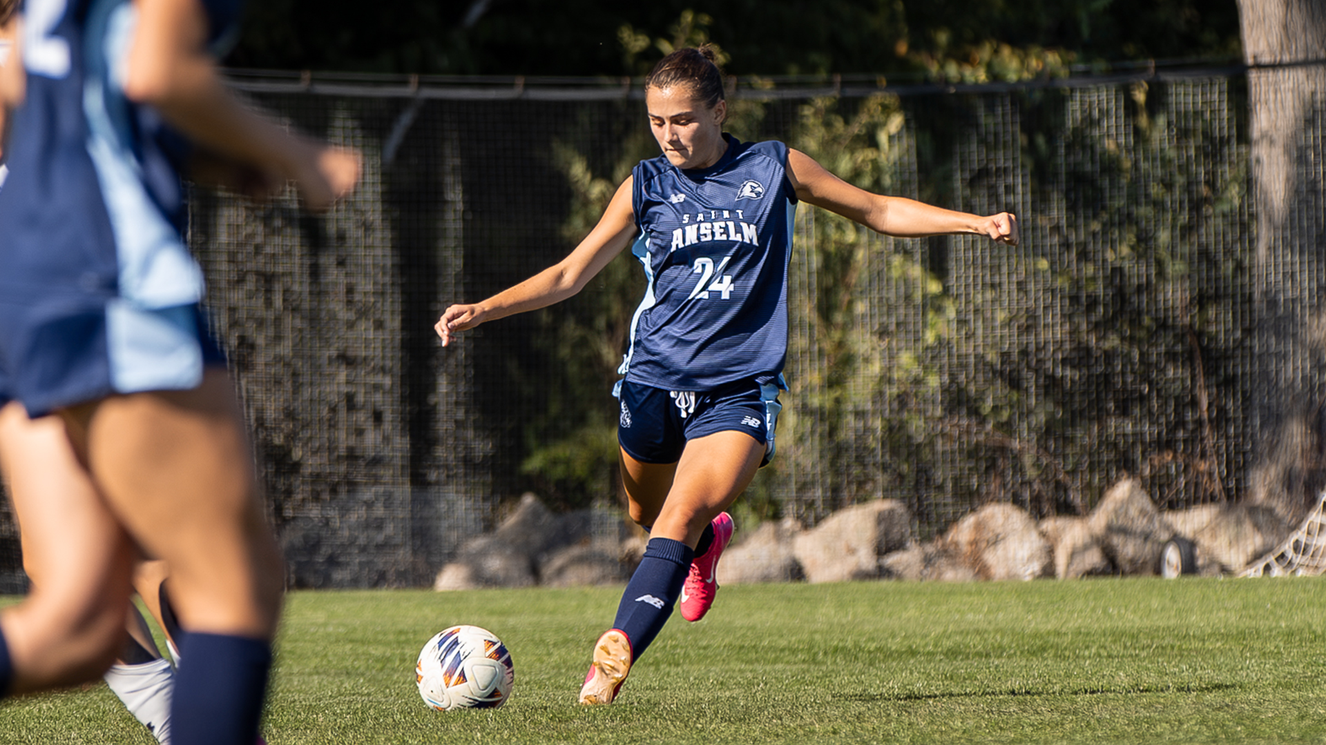 Kaitlyn LeBrun kicking the soccer ball. 