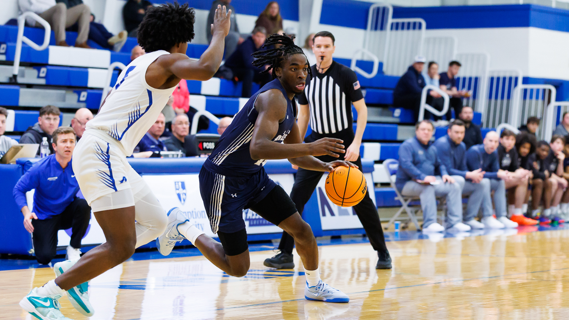 Edward Onyia drives to the basket at Assumption