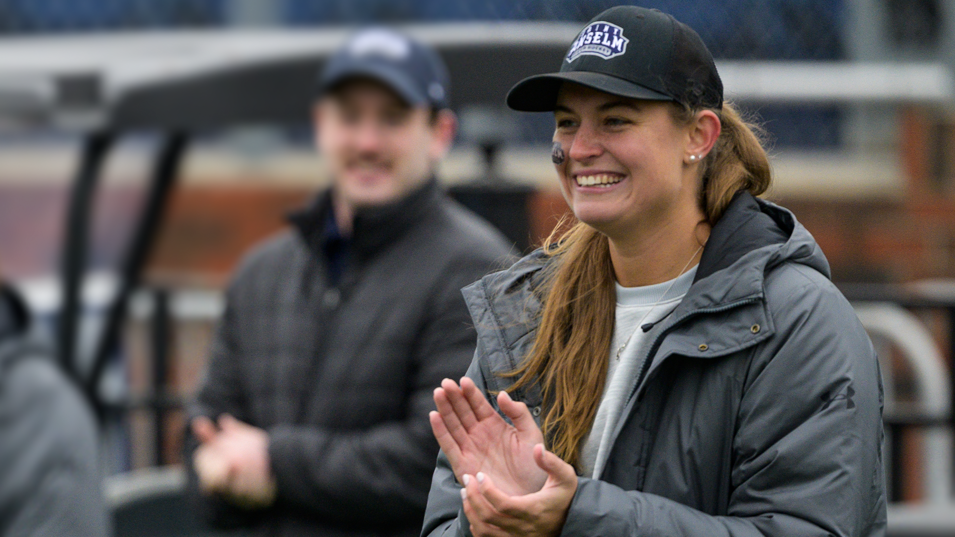 Emma Mawn smiles and claps at 2025 NE10 Championship Game