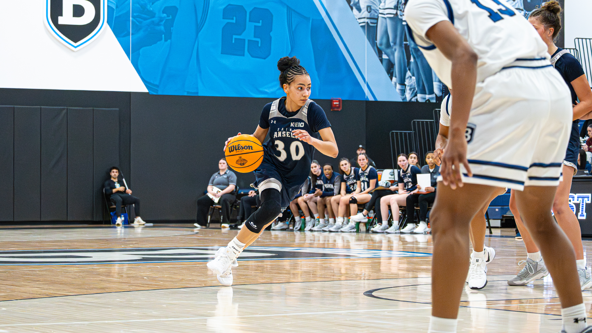 Forbes drives to the basket at Bentley 