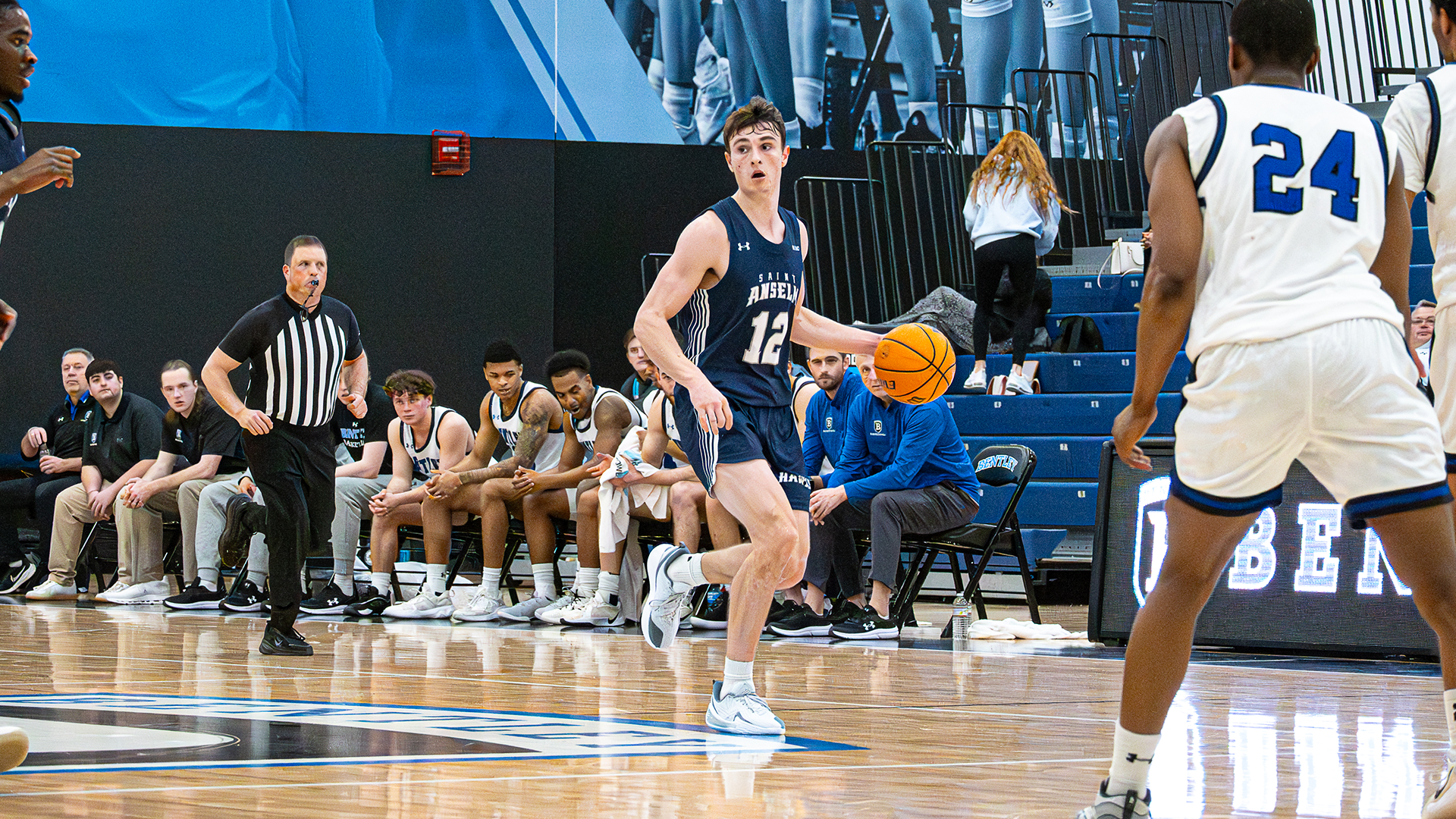 Will Davies dribbles the ball up the court at Bentley