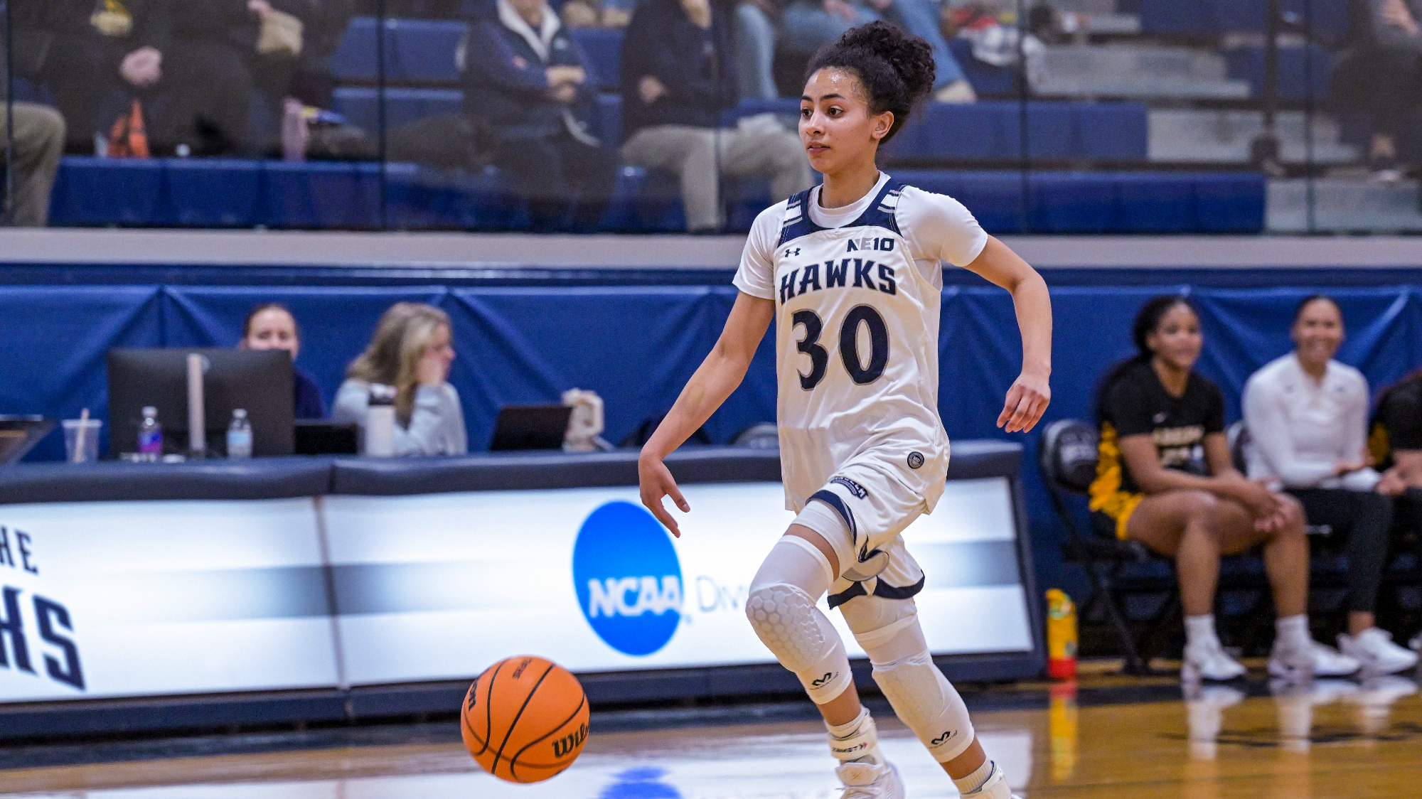 Tatum Forbes handles the ball up the court against Adelphi