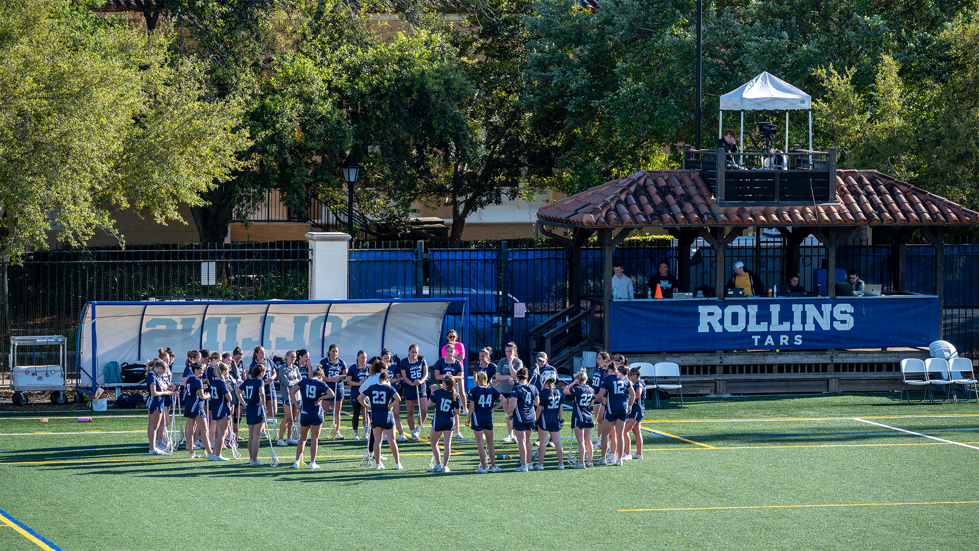 The women's lacrosse team huddles during a timeout