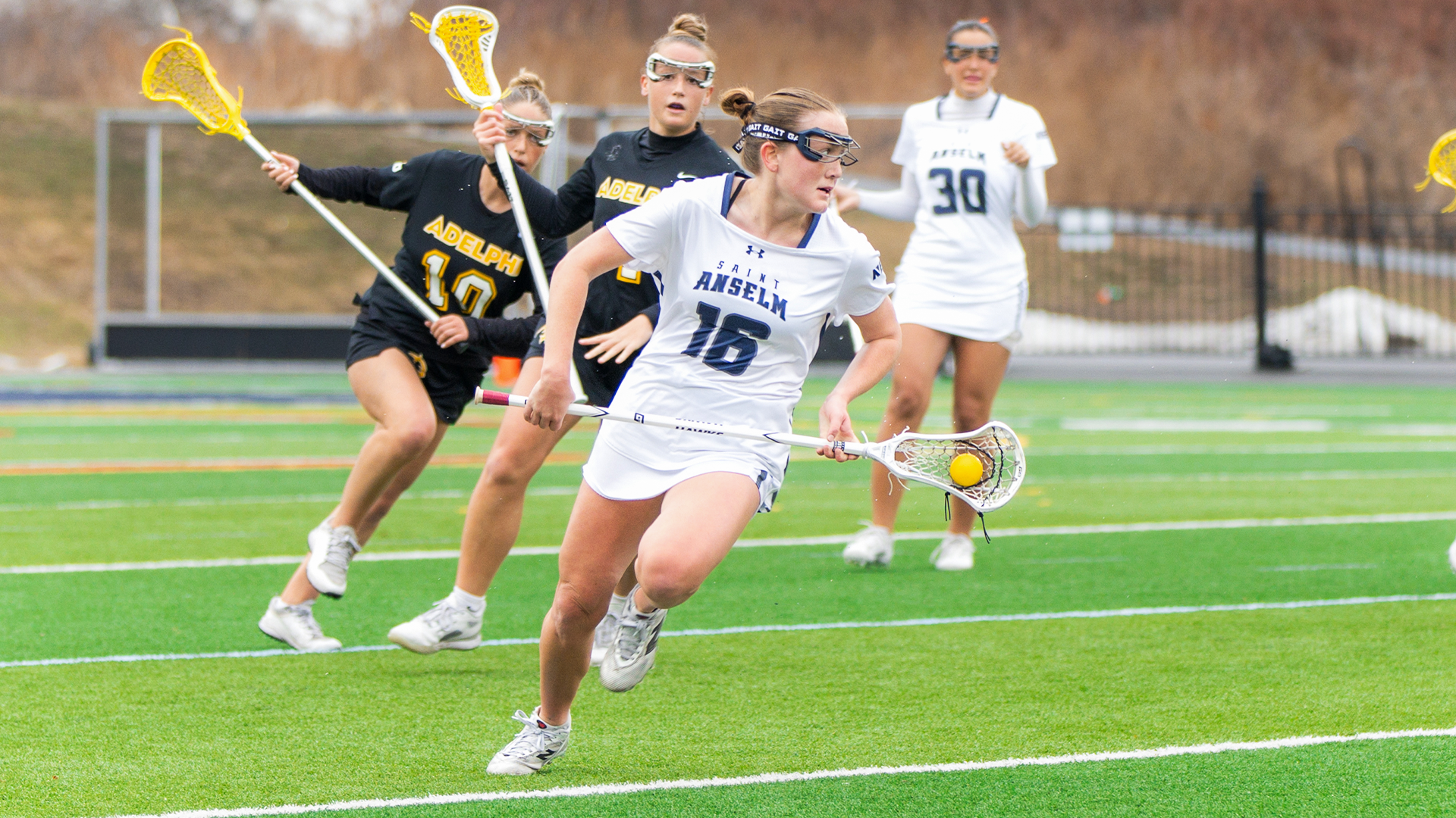 Ayla McDermod runs from opponents