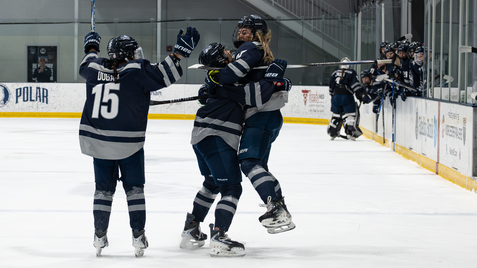 Women's ice hockey team celebrates Brooklyn Schneiderhan's goal