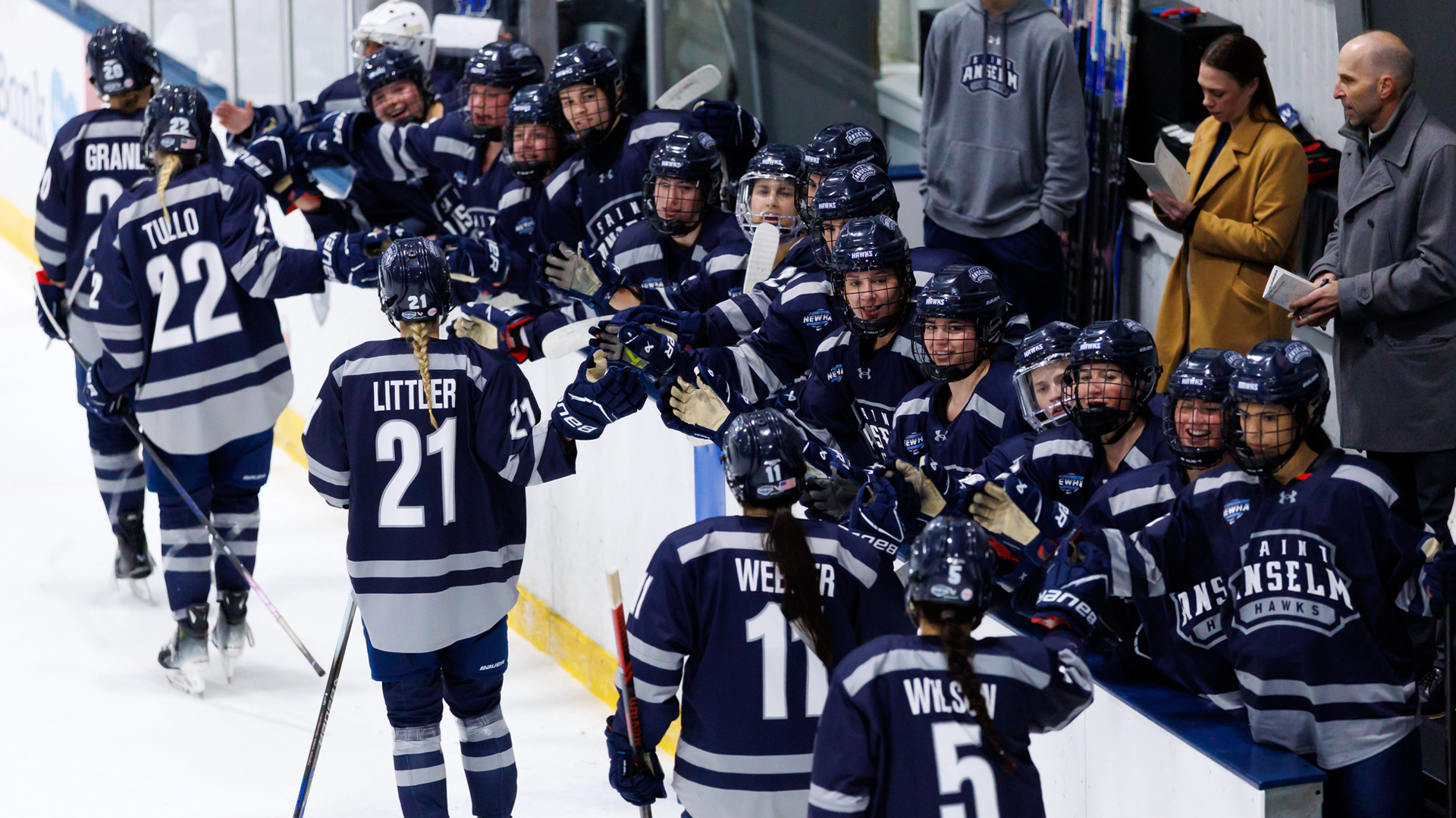Women's ice hockey team celebrates goal