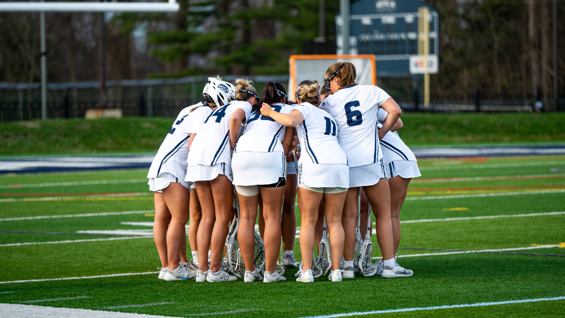 Women's lacrosse team huddles pregame
