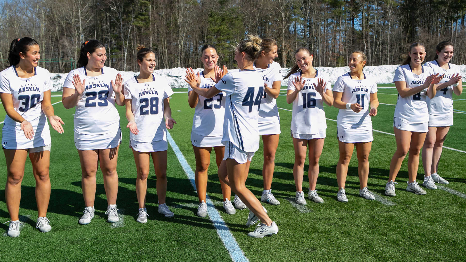Kendall Herrick high-fives teammates