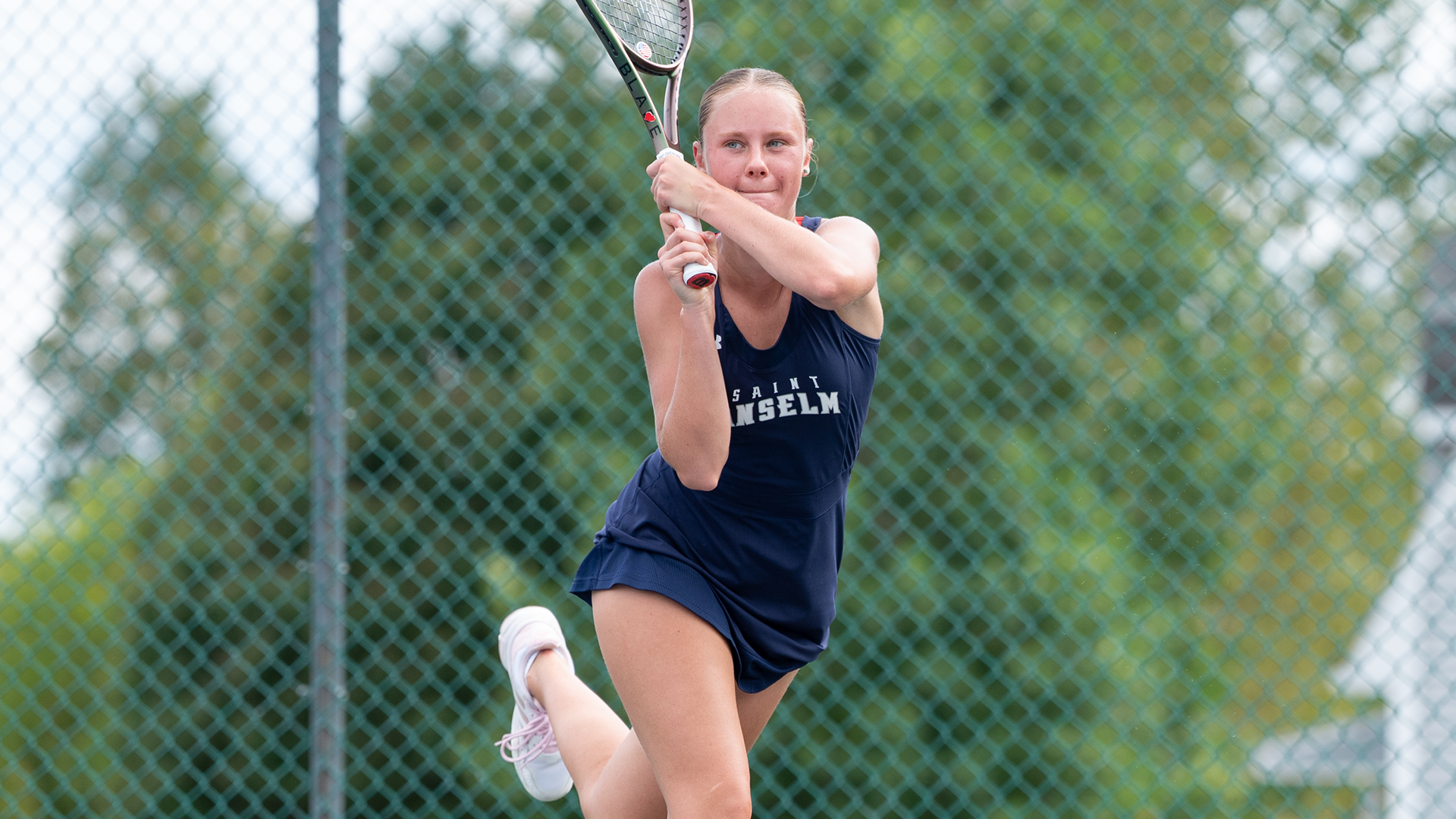 Makarenko returns ball over net