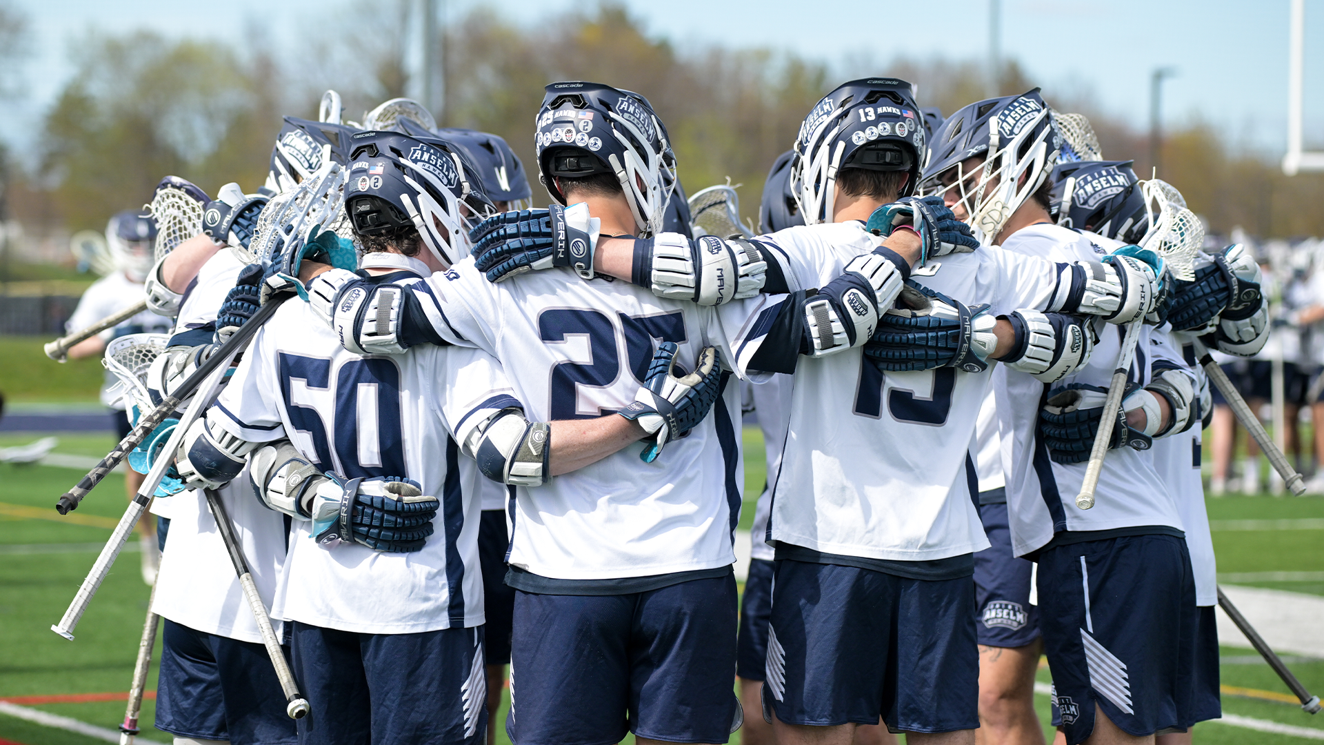 Lacrosse players huddle
