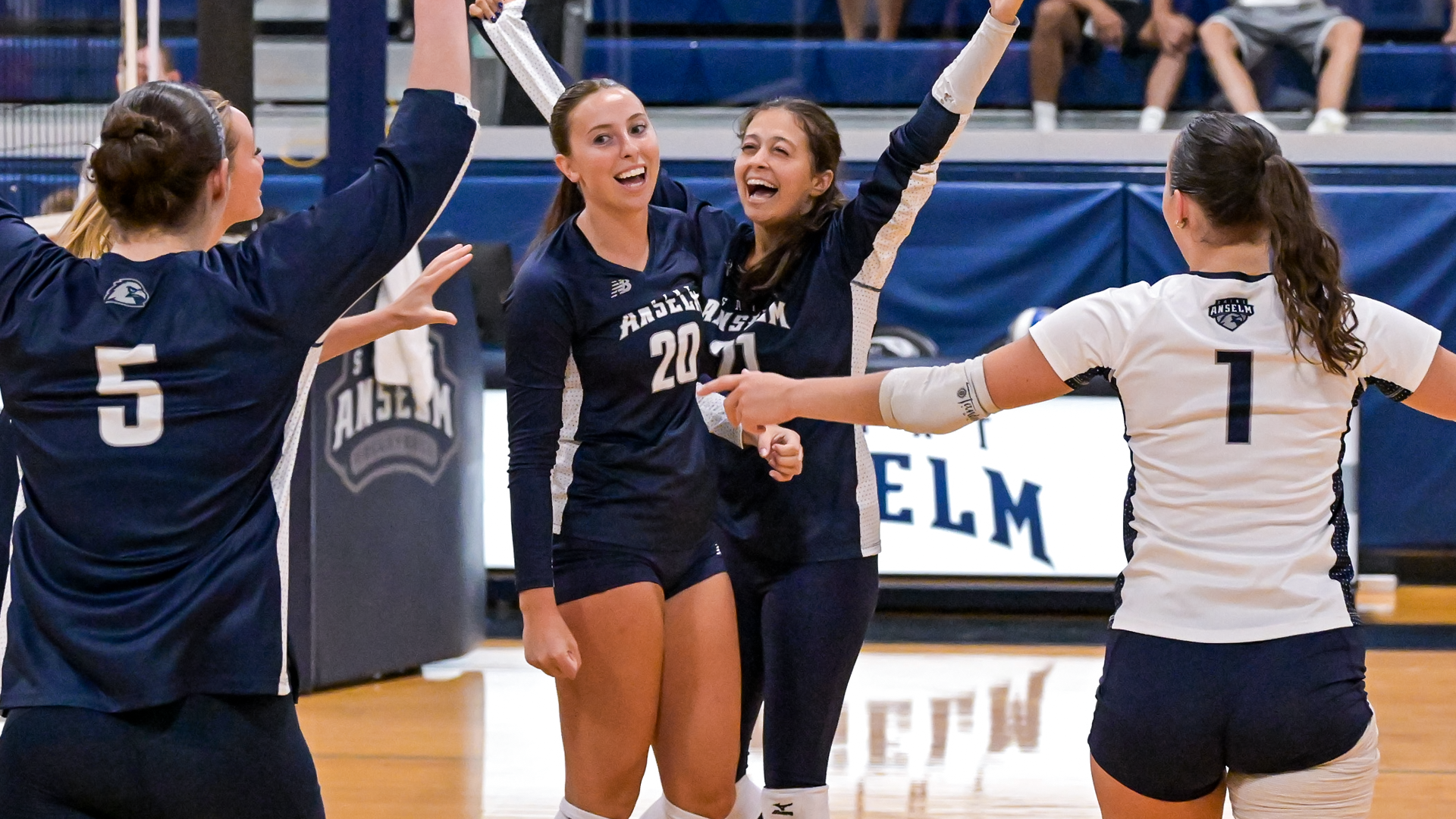 Mckenna O'Connell and Veronica Gomez celebrate a point against Dominican (N.Y.)