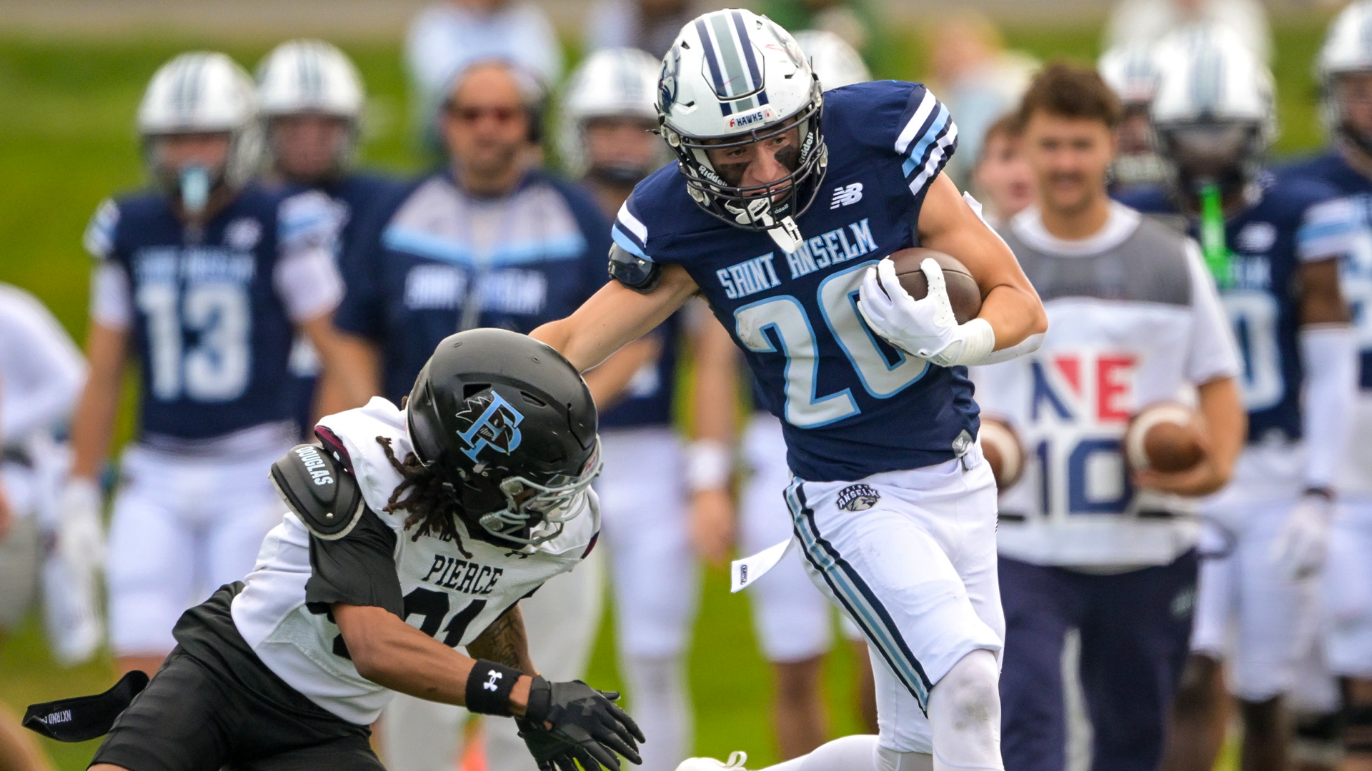 Tyler Villalta rushes with Franklin Pierce defender chasing