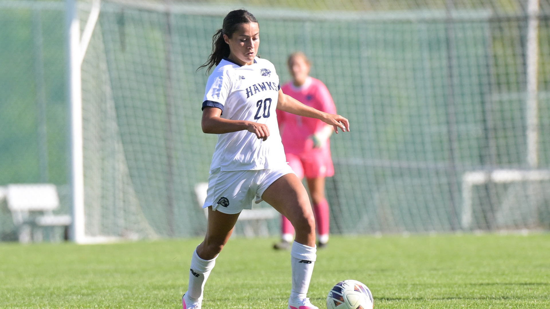 Madison Botta dribbles up the field