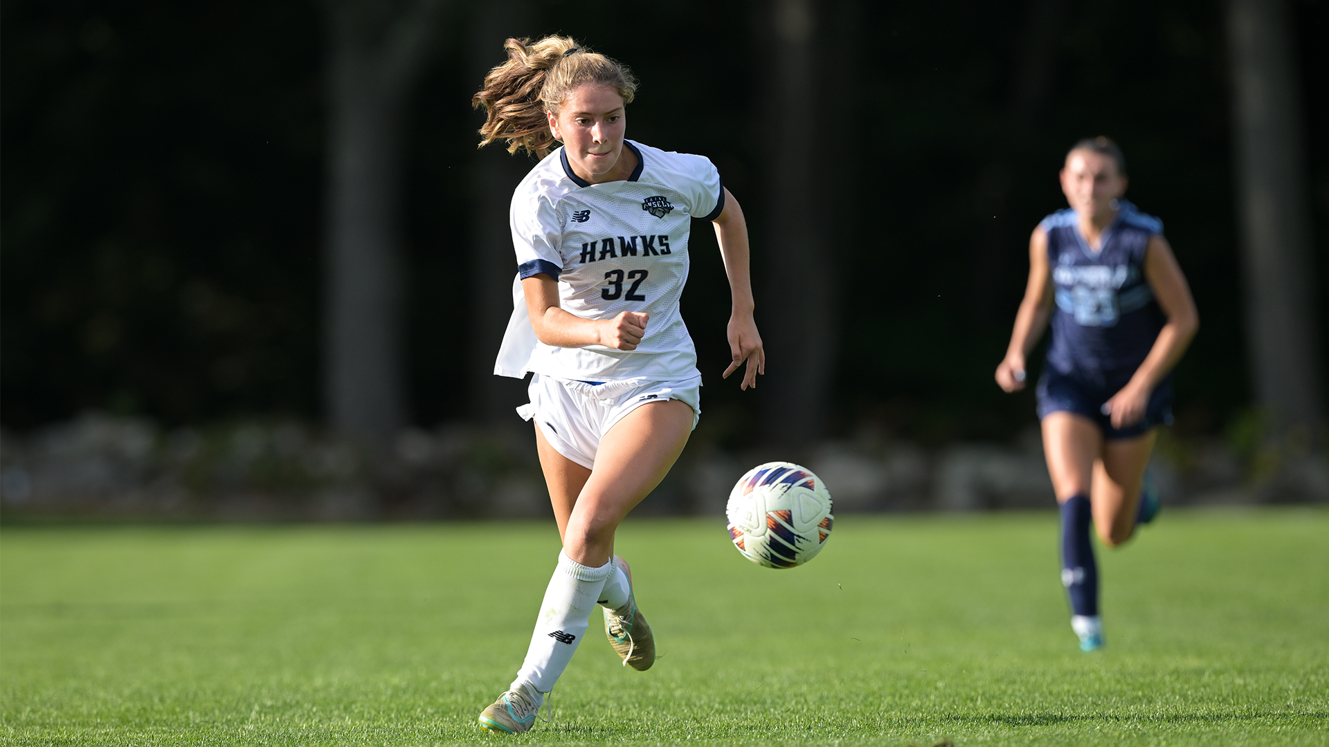 Bianca Maciel chasing after the ball. 