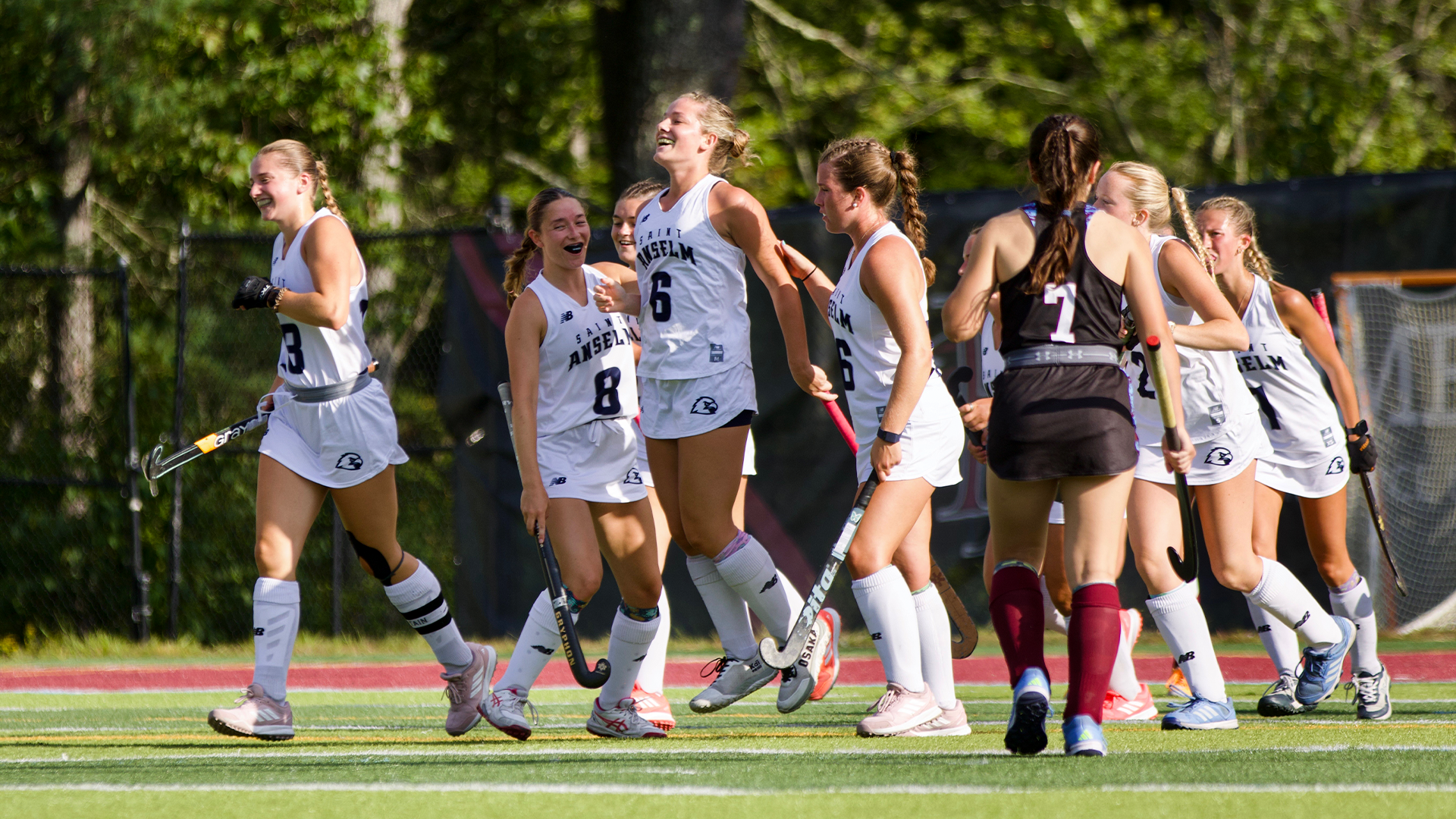 Sophie Smith and field hockey teammates celebrate goal