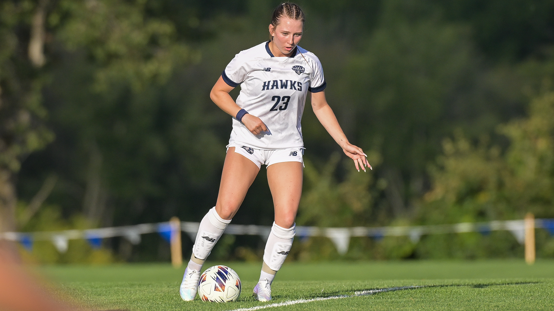 Scarlett Flint controls the ball during a women’s soccer match at Melucci Field.