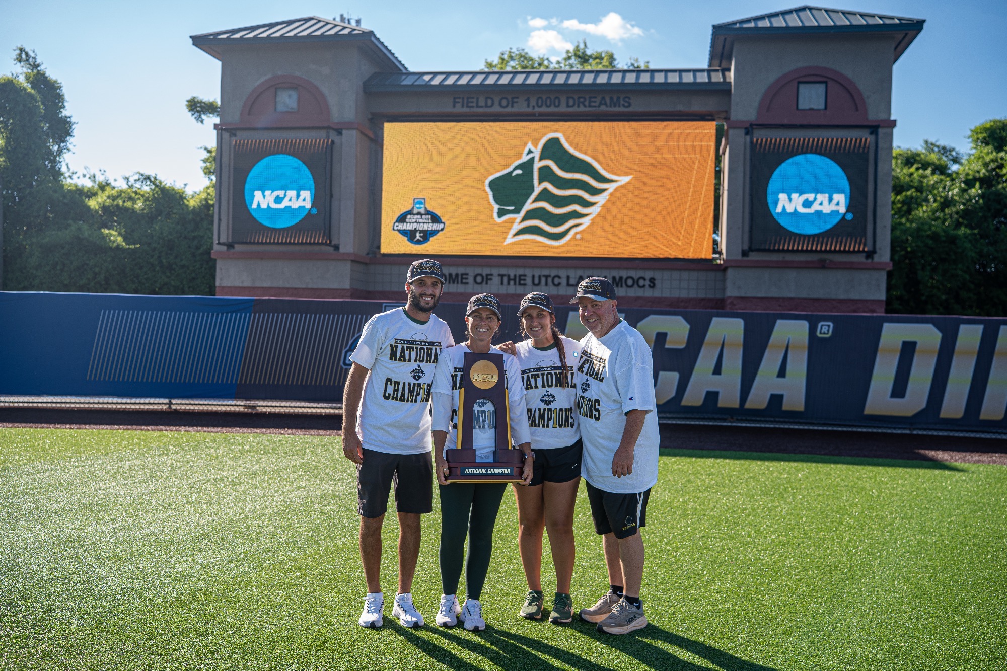 2026 Coaching Staff with trophy