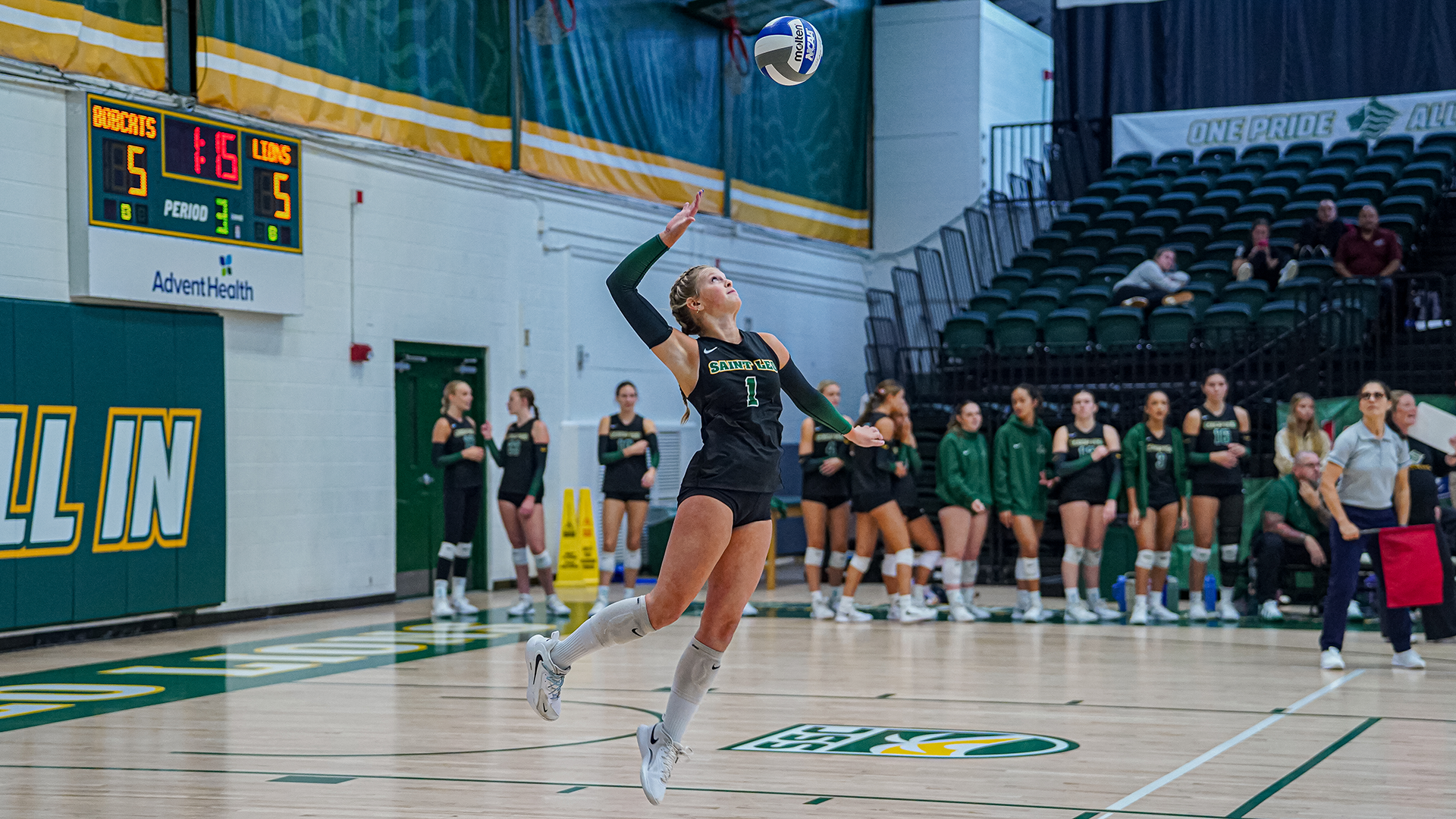 Elle Smith serves the ball against Georgia College