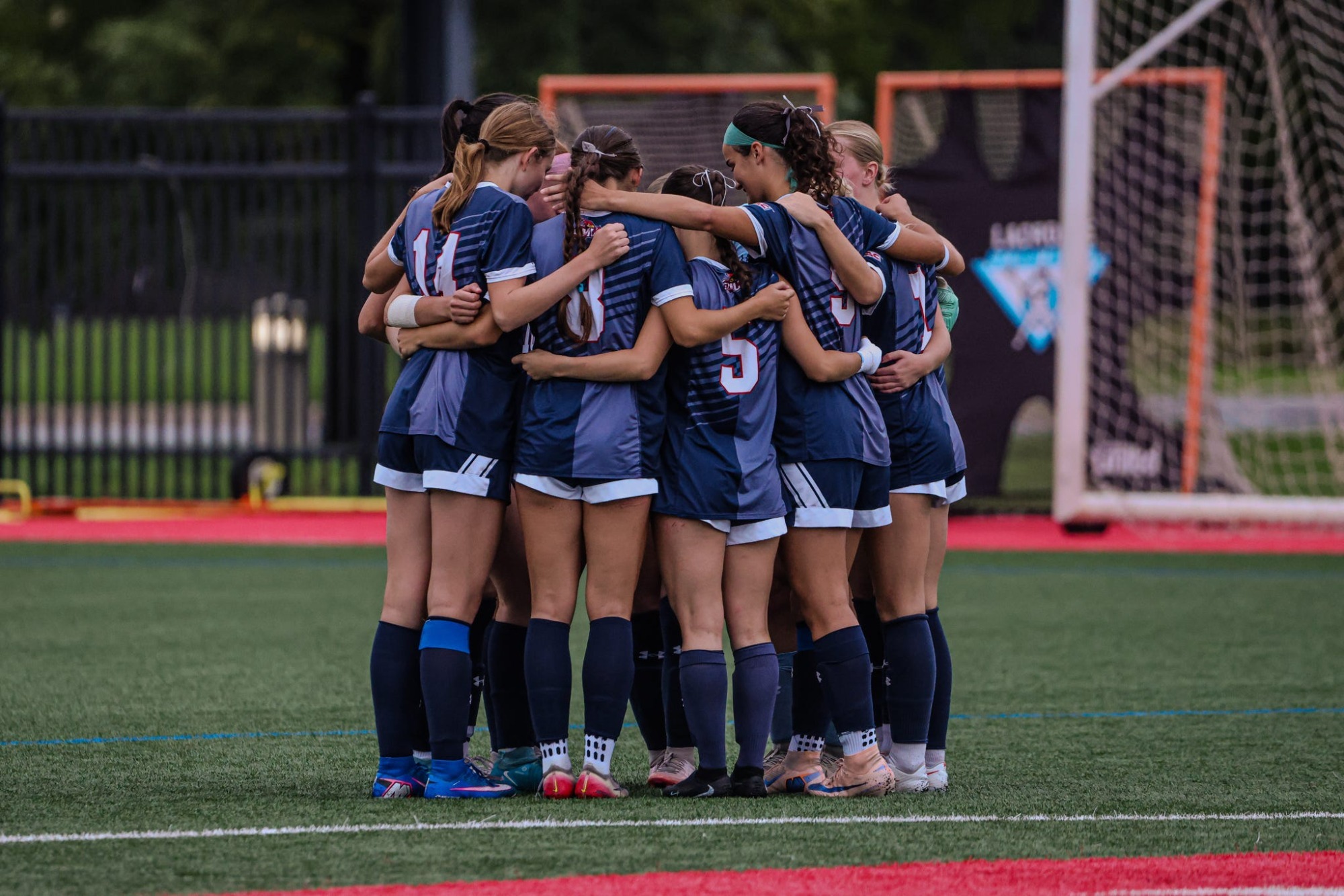 WOmen's SOccer Huddle
