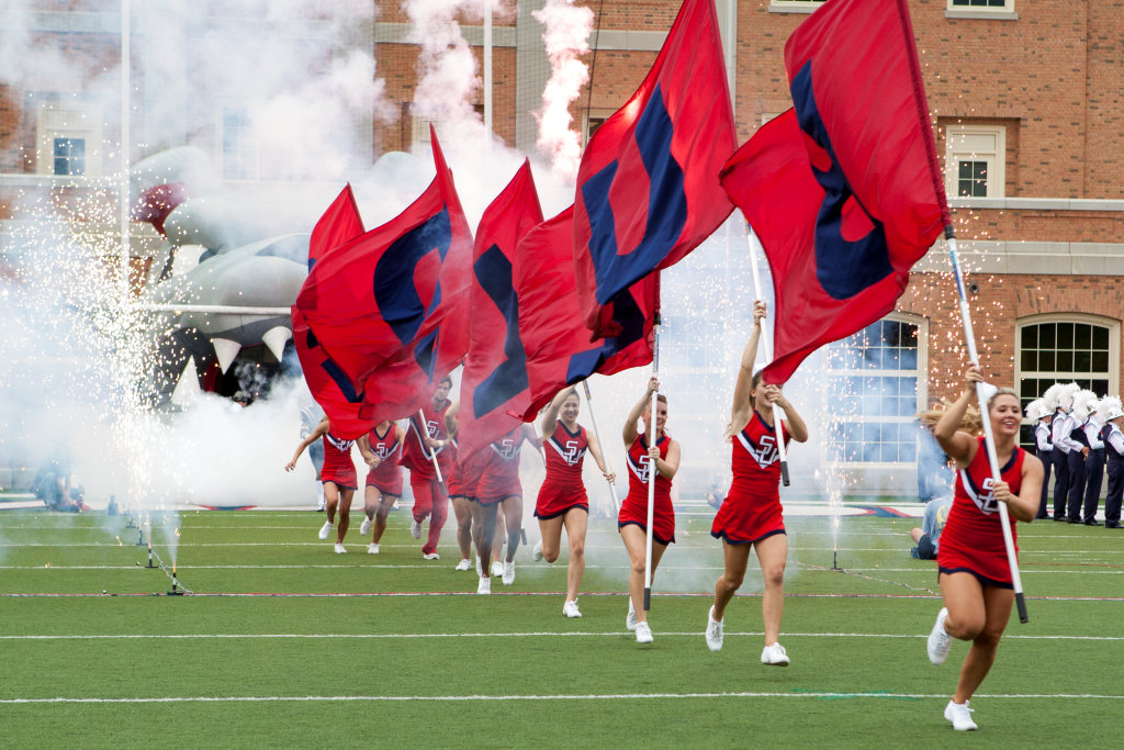 Cheerleaders leading the team onto the field against Furman, 2012