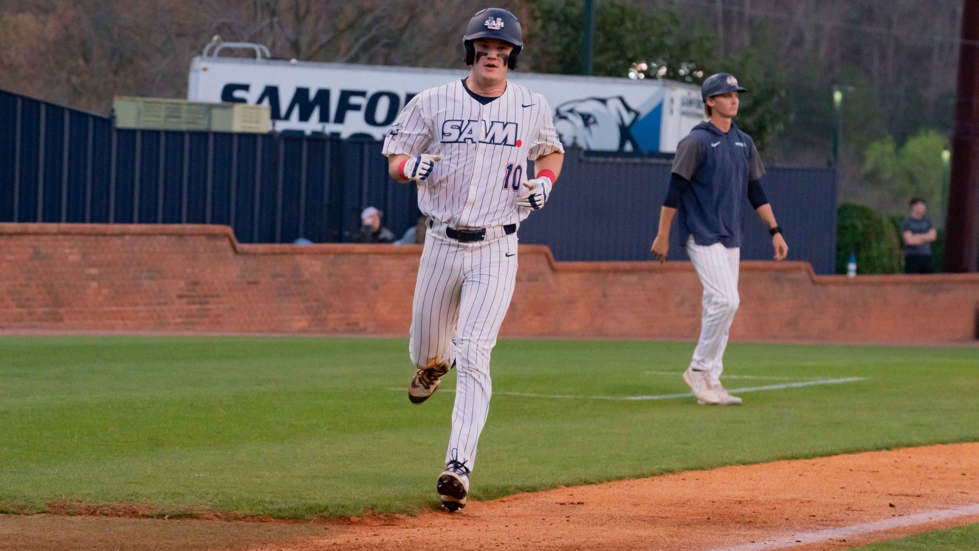 Trey Higgins scoring a run in 2025