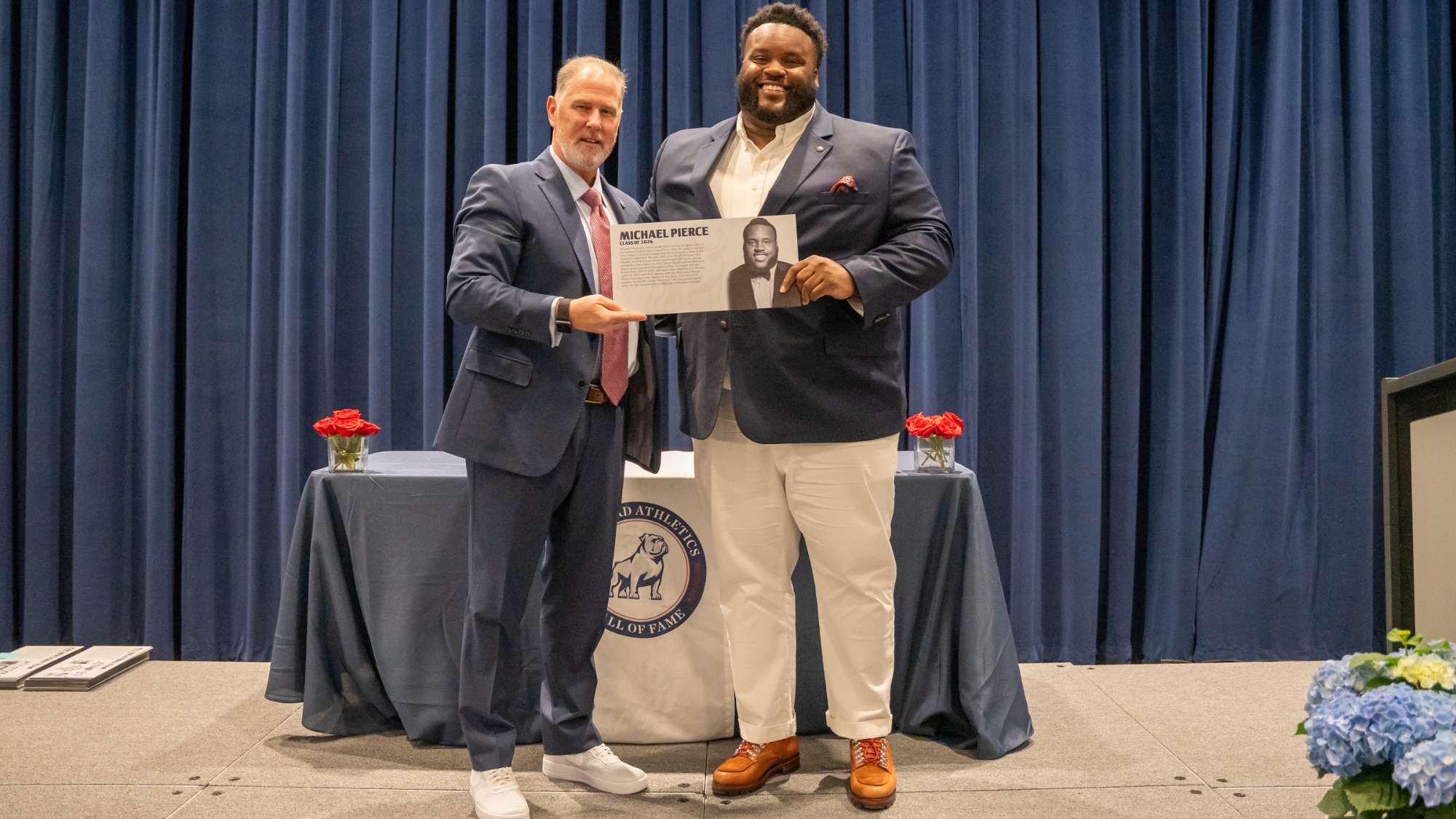Michael Pierce with 2026 Hall of Fame Plaque
