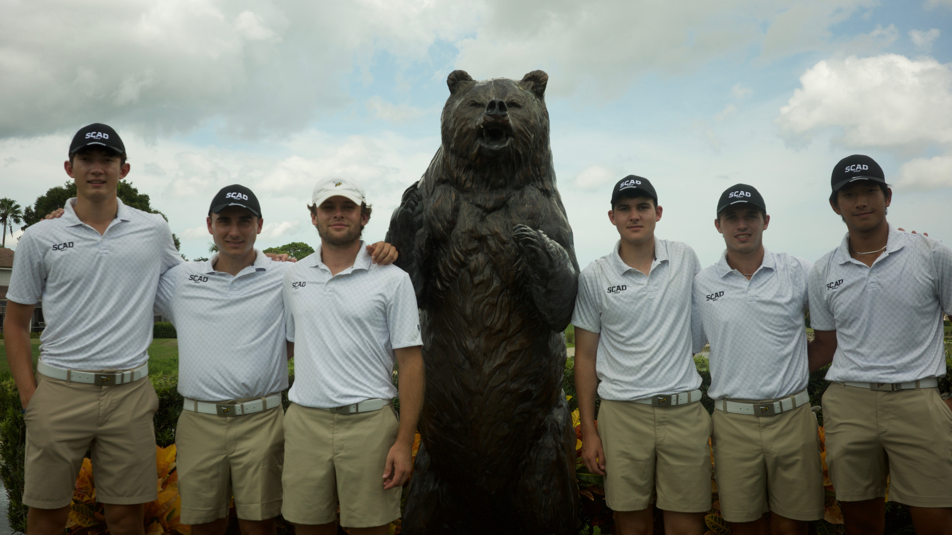 Men's Golf poses with the bear at the PDI Shootout.