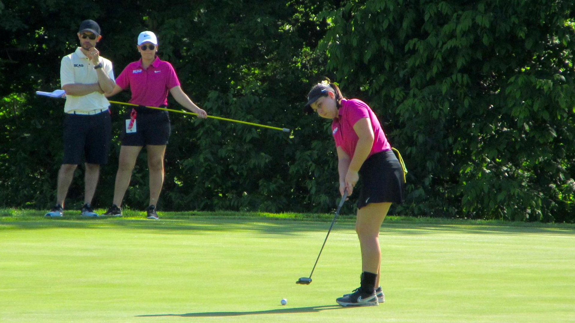 Martha Sanchez focuses on her shot.
