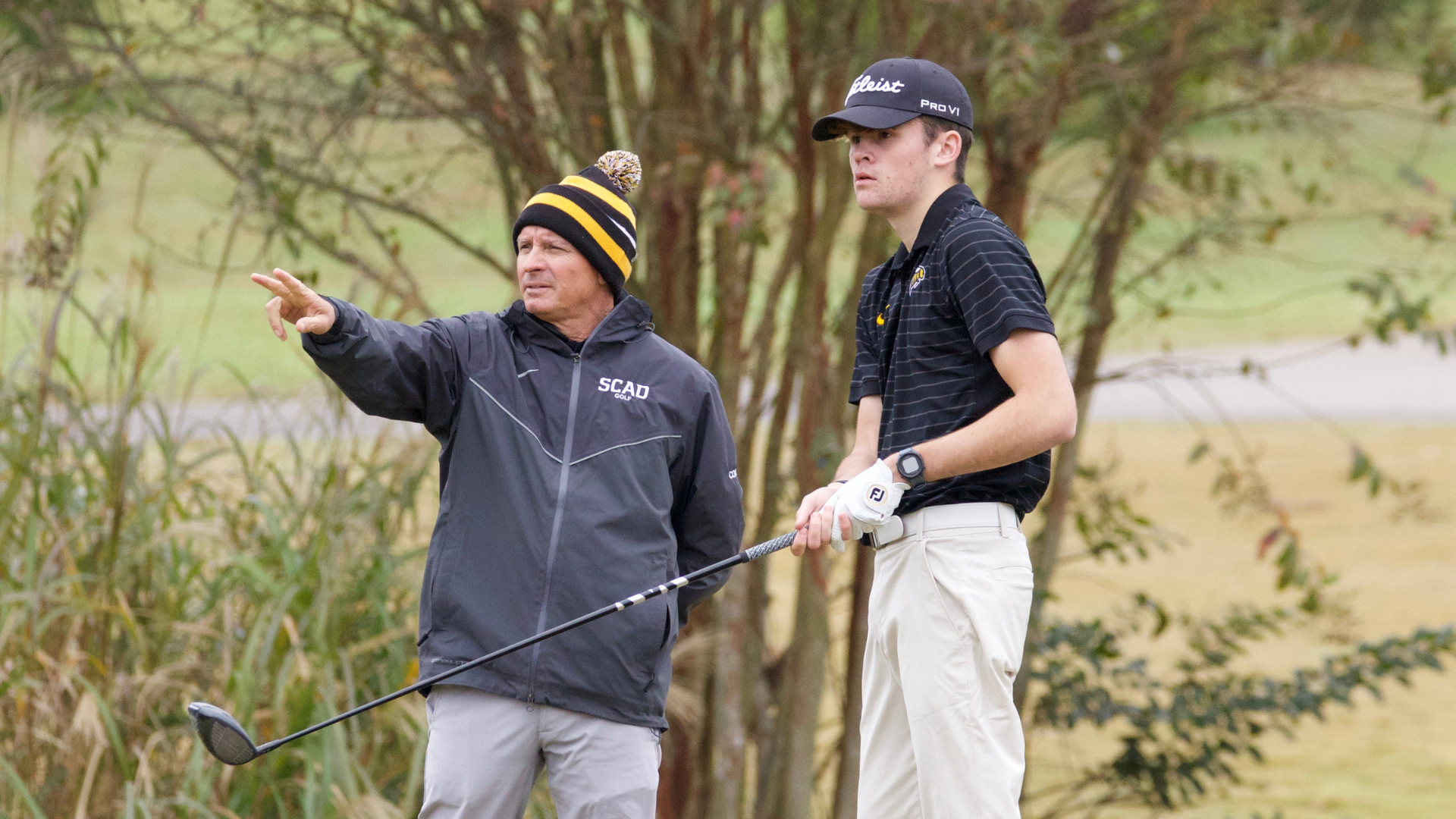 Pierce Long receives advice from Coach Chris Knobloch.