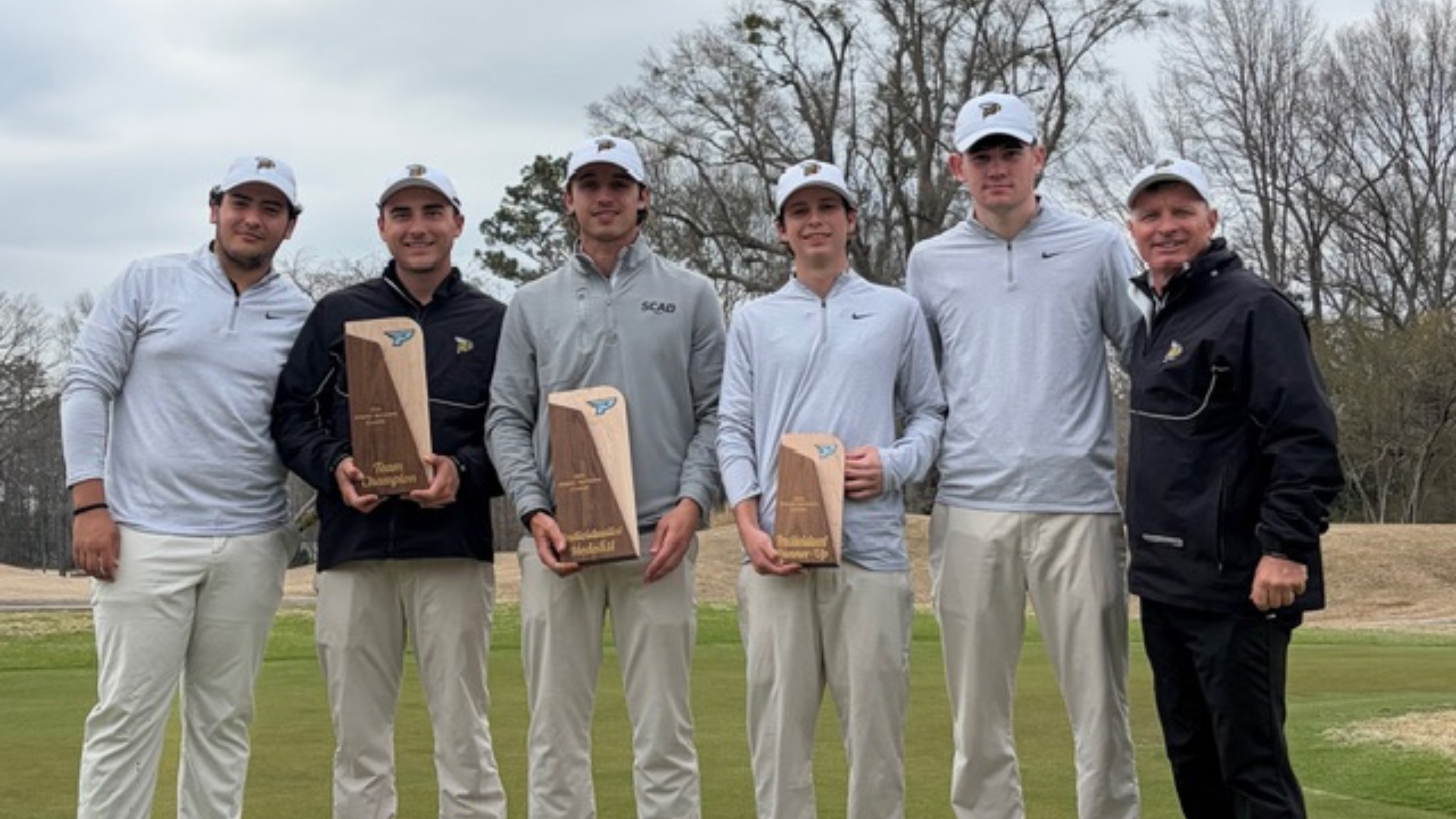SCAD Atlanta Men's Golf poses with their awards after the Spring Skyhawk Invitational.