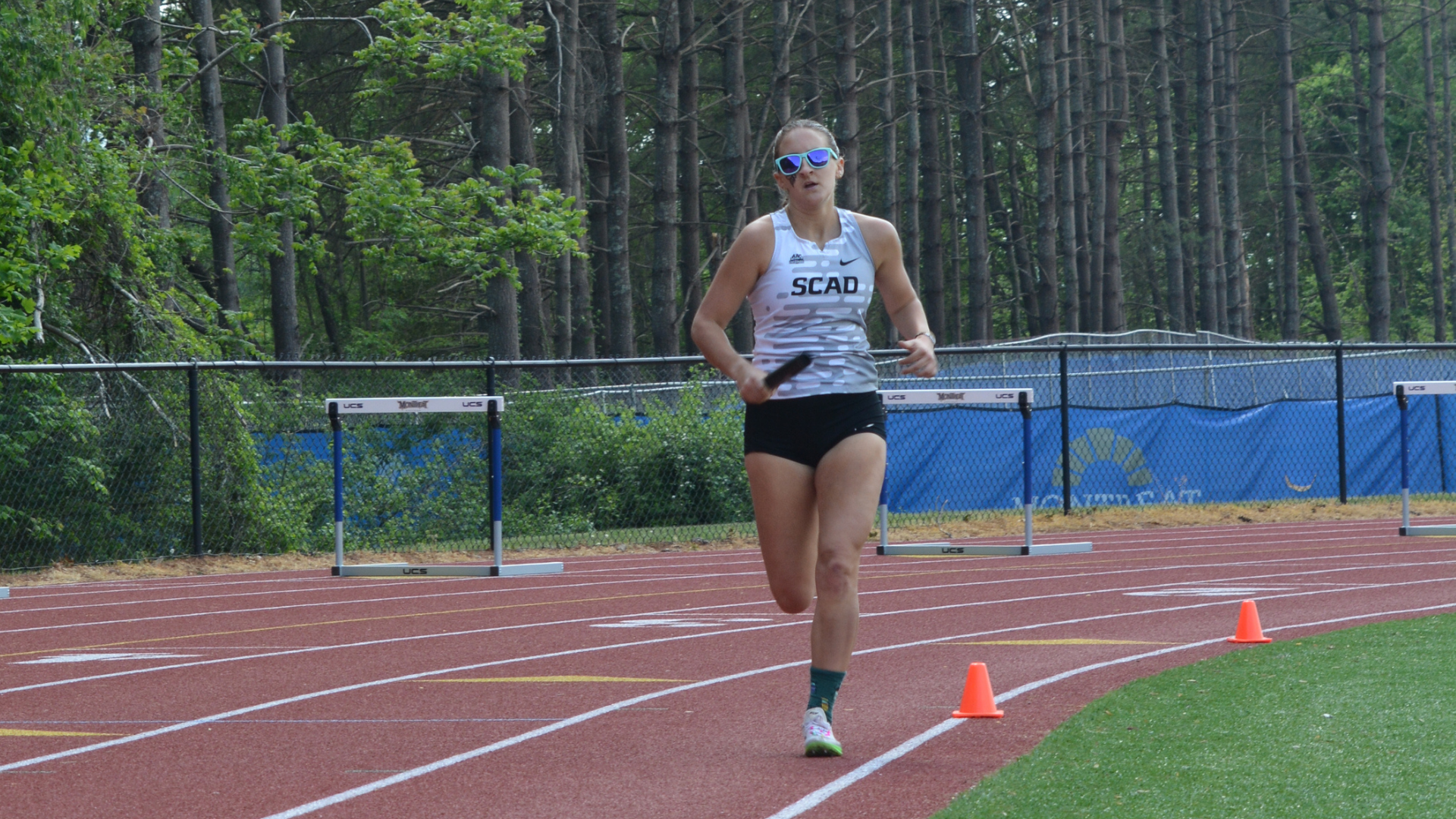 Azalea Snell races in the 4x800 Meter Relay at the AAC Championships.