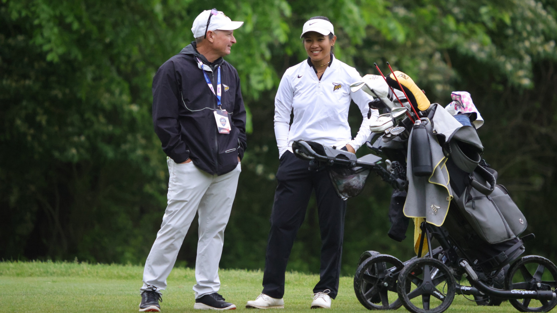 Charlotte Huynh and Coach Chris Knobloch celebrate after her hole in one
