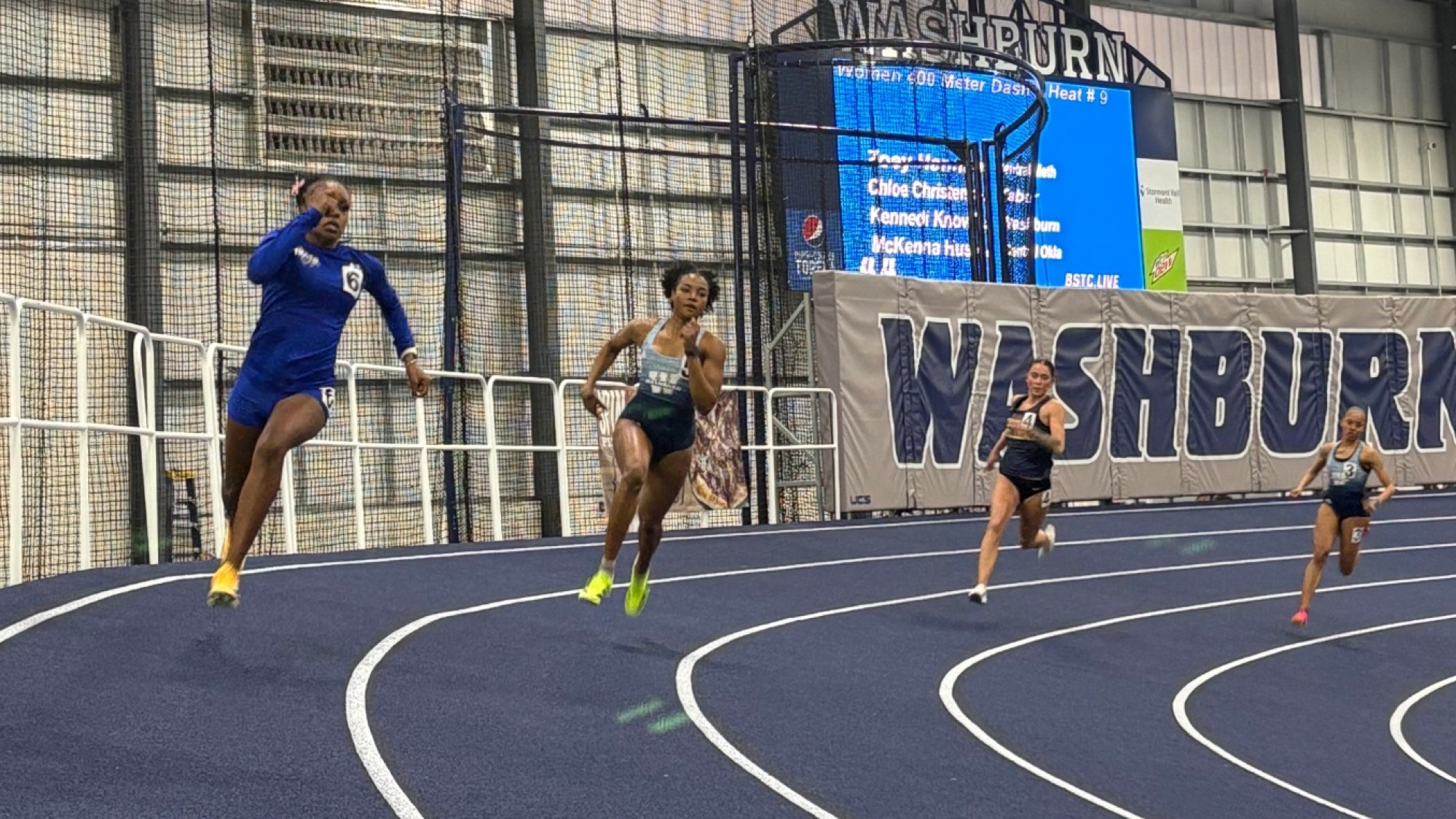 Madison Rowe competes in the 200 meters at the Washburn Alumni Invitational