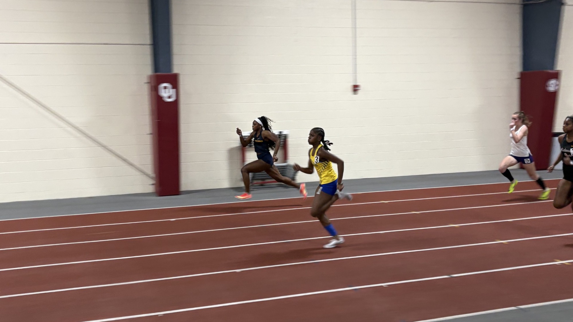 Taniya Burke competes in the 60 meter run at the Owen Hewett Invitational