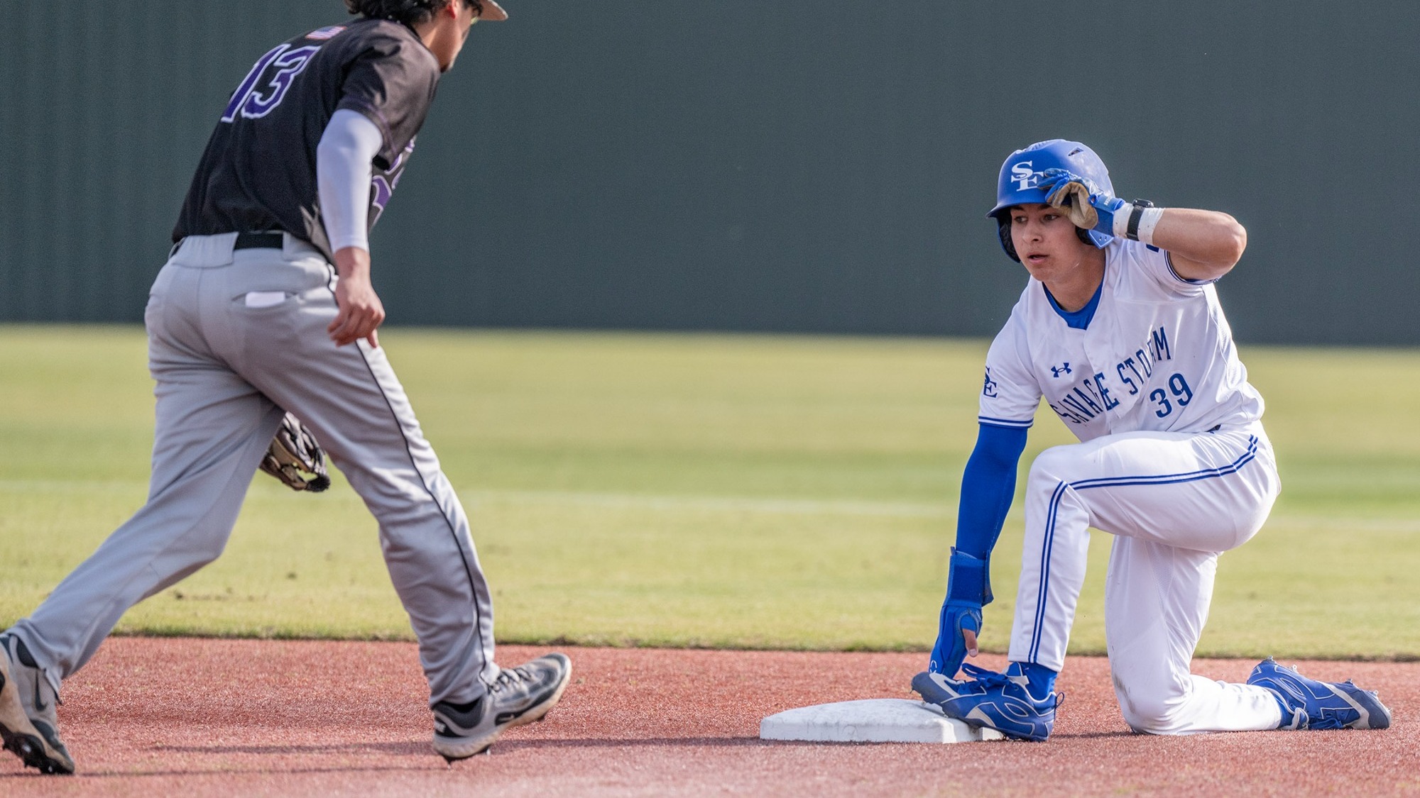 Isaac Villa stands after sliding into second base
