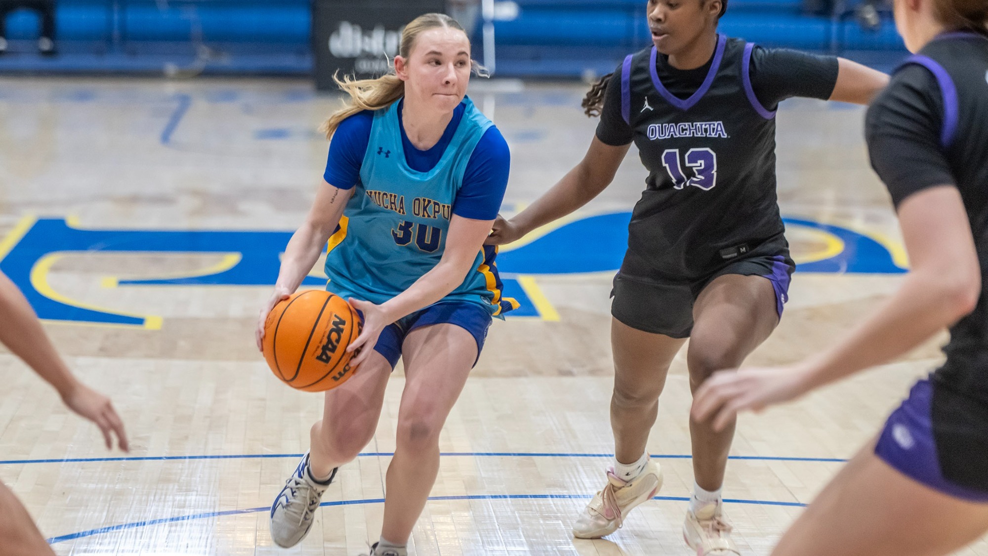 Katie Allen drives the lane versus Ouachita Baptist