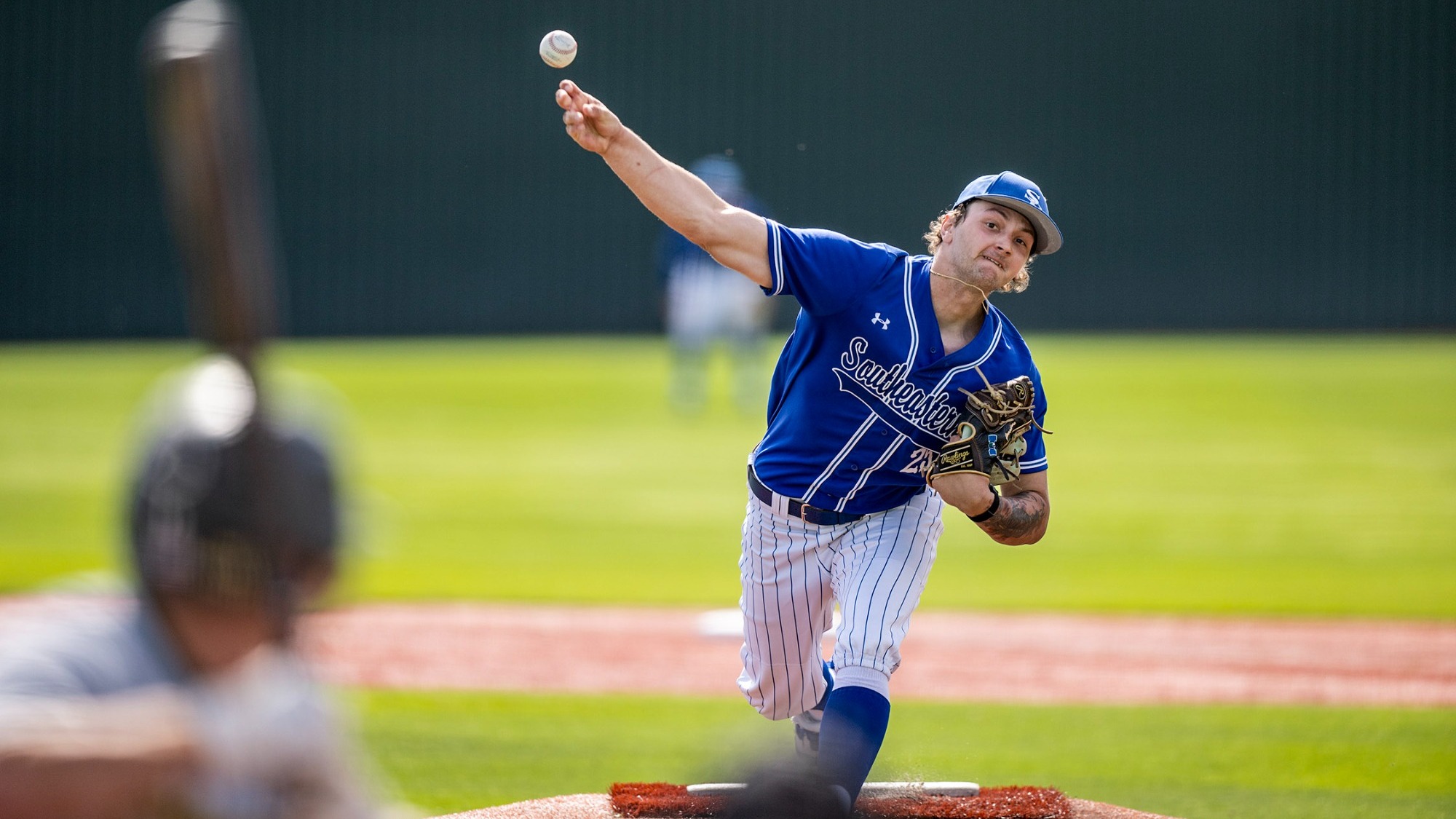 Dylan Hill delivers a pitch versus Arkansas Tech
