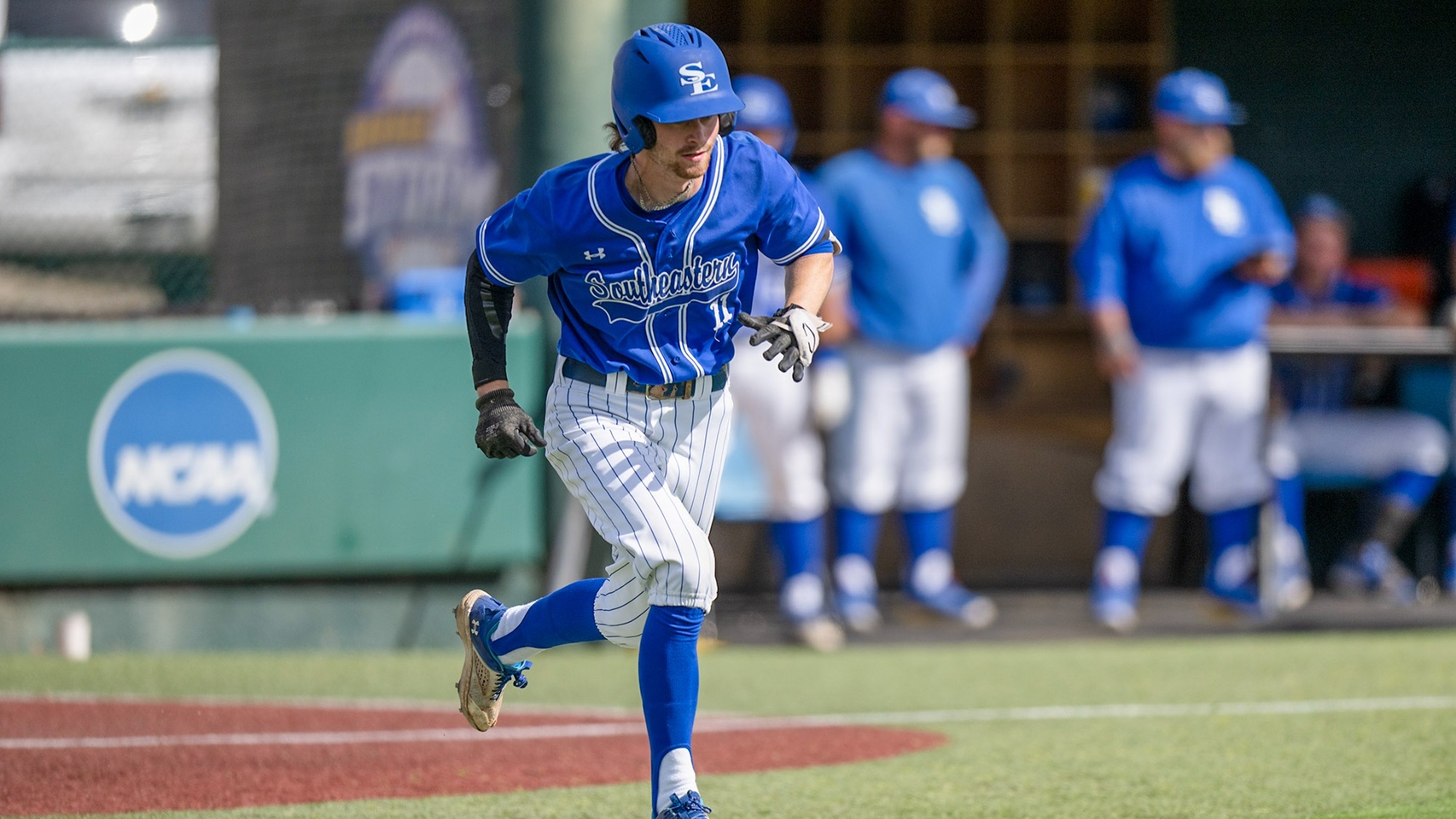 Alex Showalter runs to first base