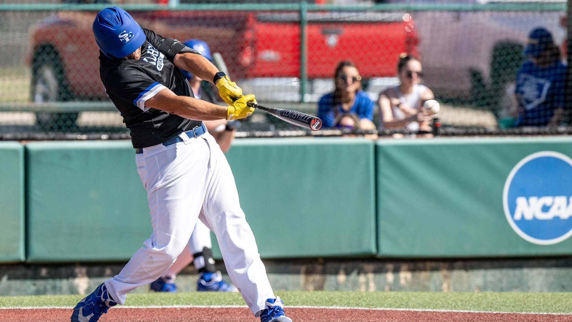 Carter Olson takes a swing versus East Central
