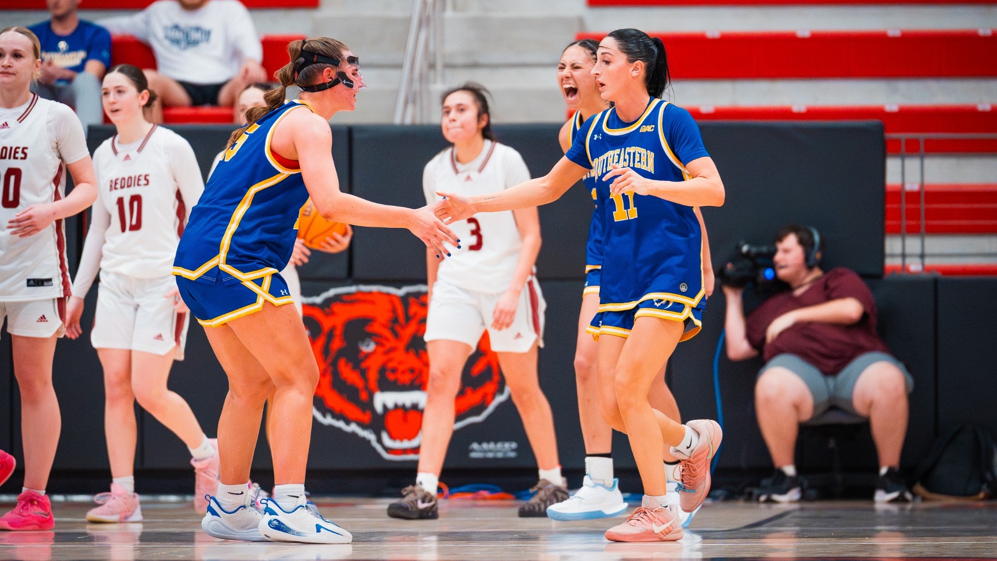 Tori Kilbur (Left) and Kenzli Warden (Right) celebrate during Southeastern's GAC Tourney win over Henderson State
