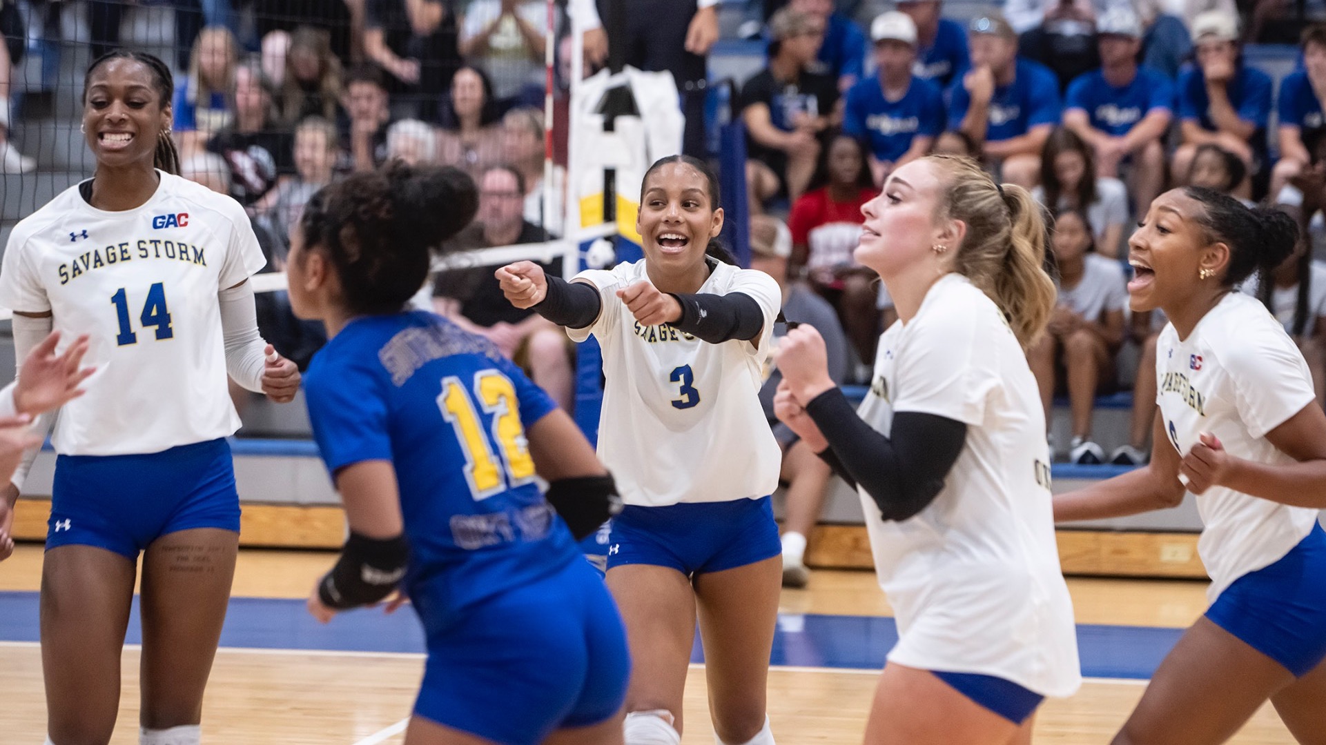 SE volleyball celebrating a point vs. SNU