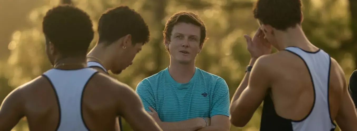 Coach AJ speaks with runners