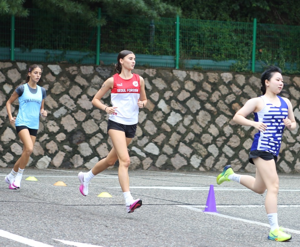 Girls XC Running as One