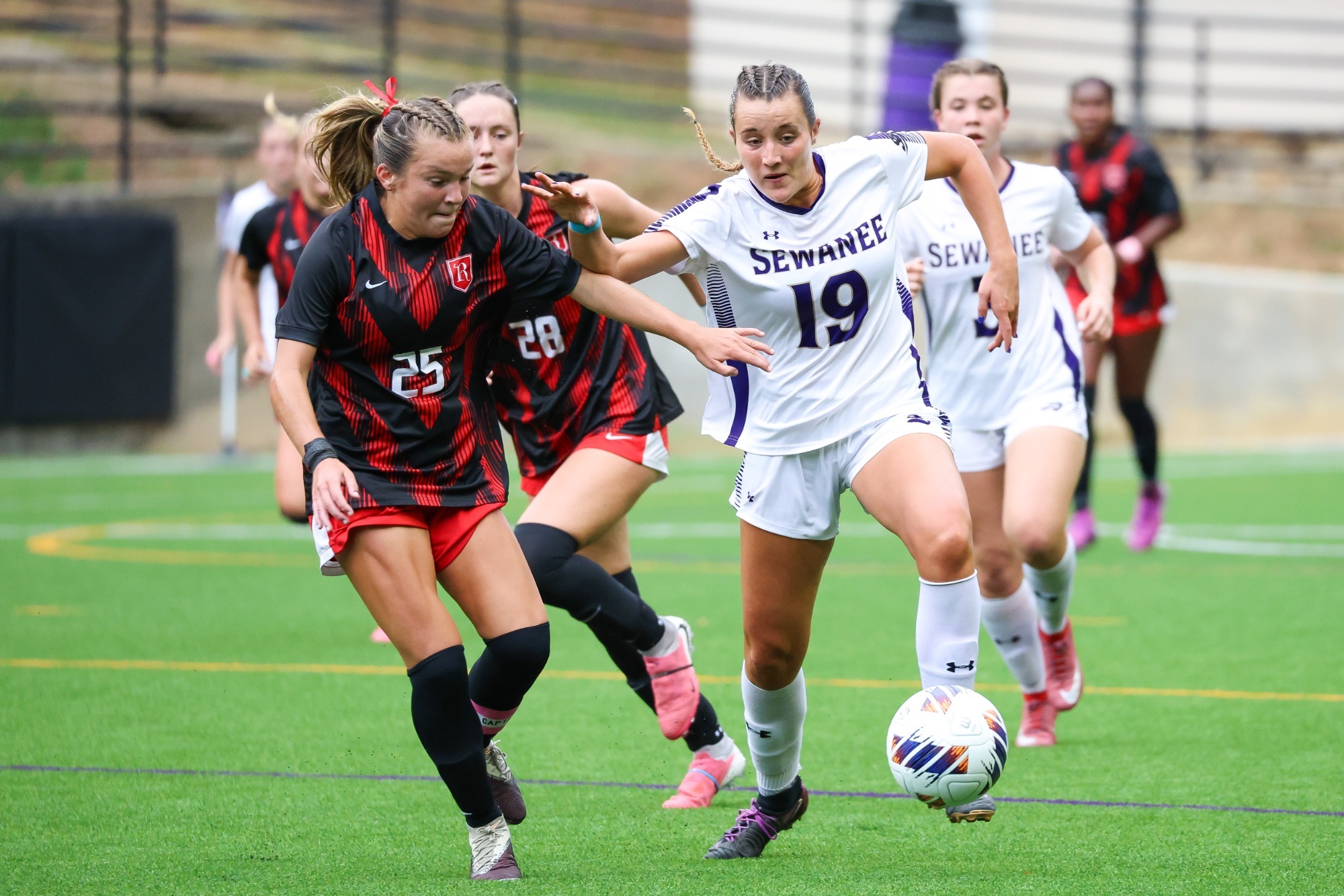 Pope Scurlock takes the ball upfield against Rhodes