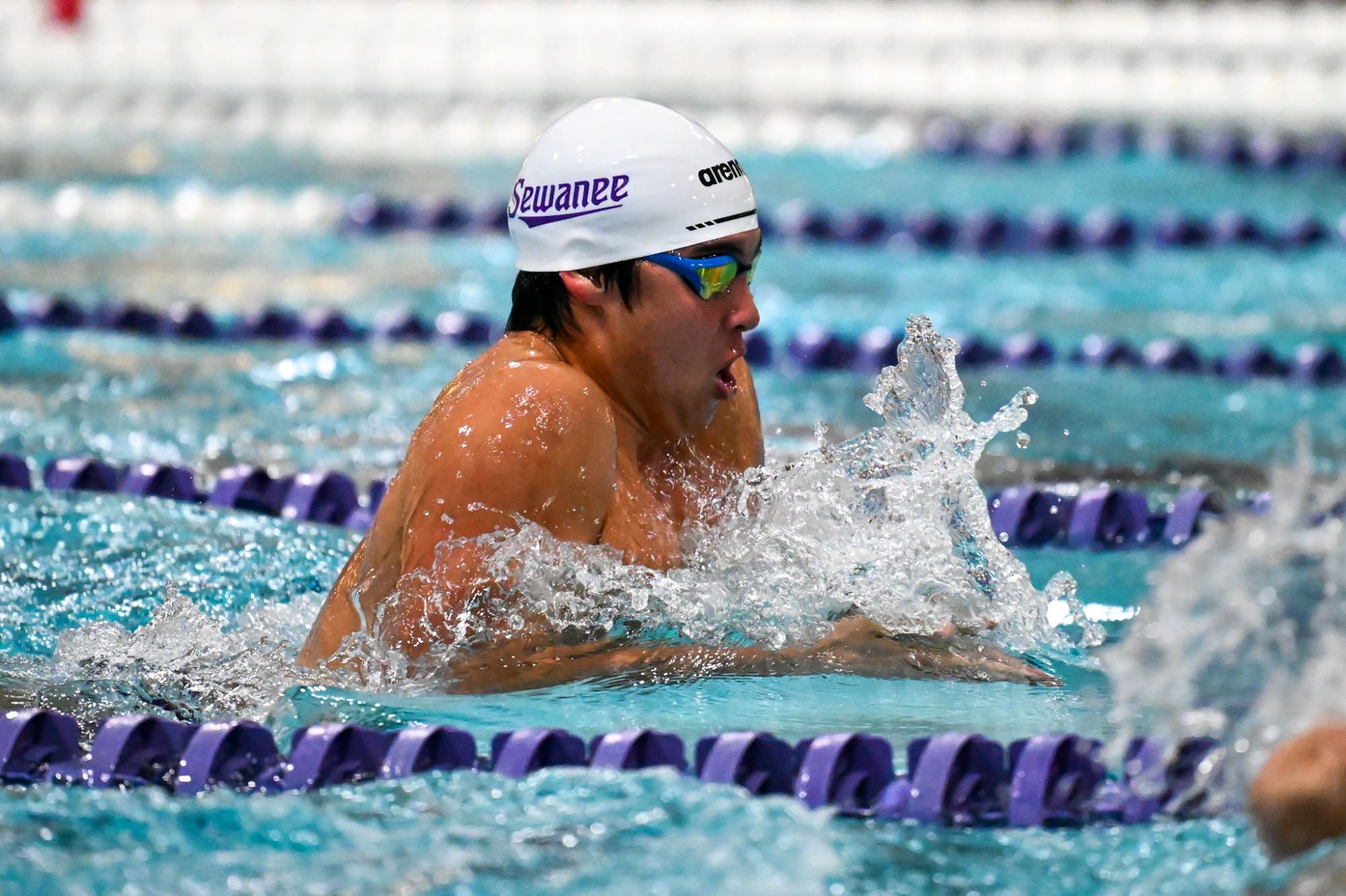 Sewanee men's swimmer performs the breaststroke